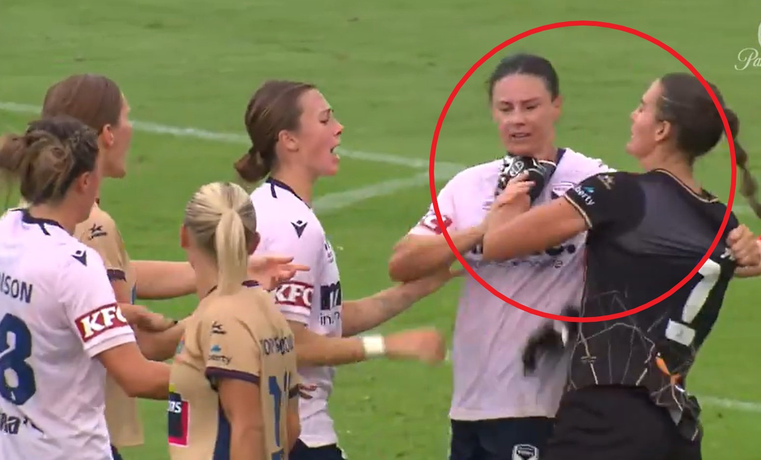 Isobel Nino grabs Emily Gielnik by the throat.