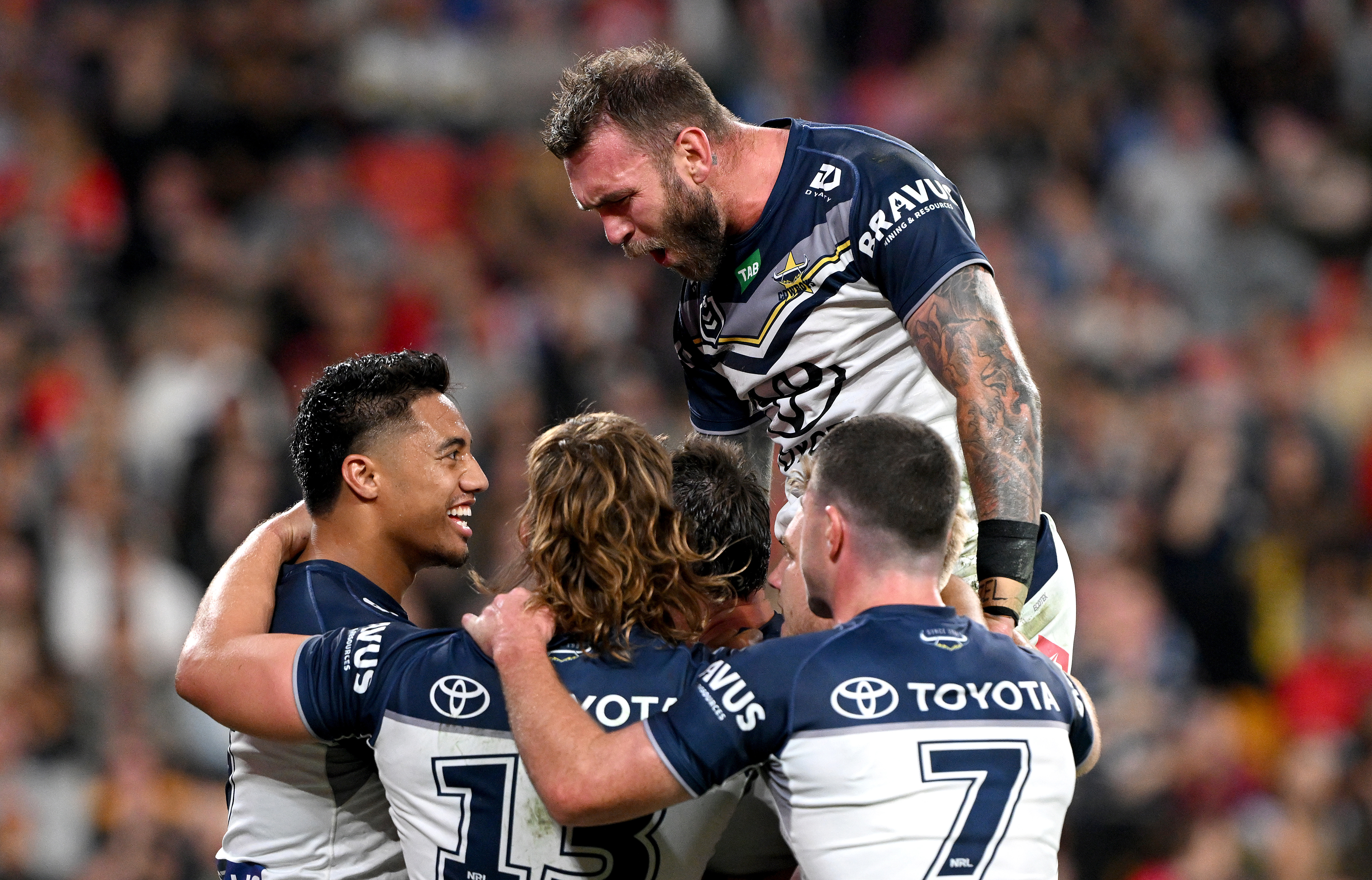 Scott Drinkwater of the Cowboys is congratulated by team mates after scoring a try during the round 26 NRL match between Dolphins and North Queensland Cowboys at Suncorp Stadium on August 25, 2023 in Brisbane, Australia. (Photo by Bradley Kanaris/Getty Images)