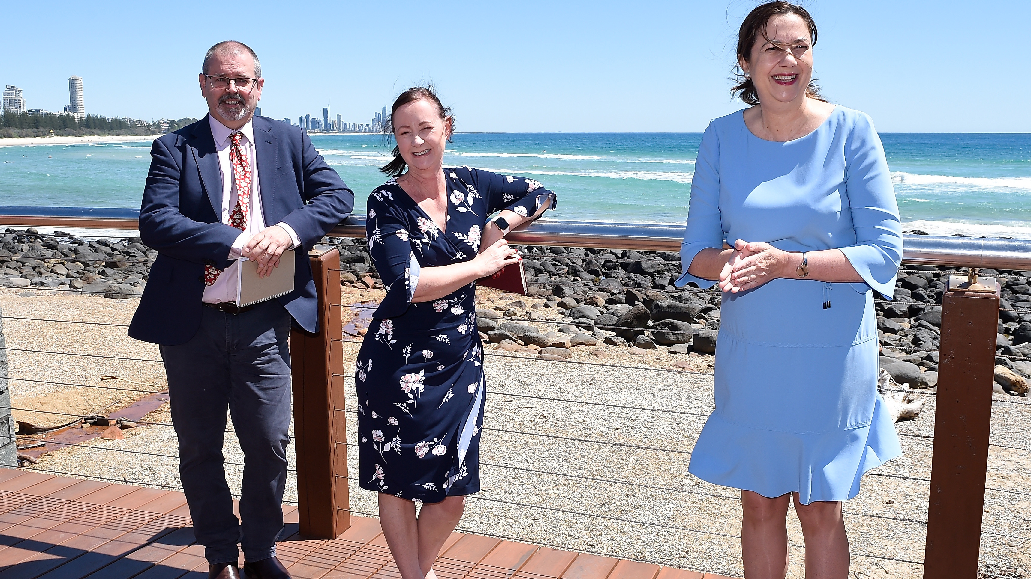 Dr Peter Aitken and Health Minister Yvette D'Ath and Premier Annastacia Palaszczuk pose for a photo in Burleigh Heads.