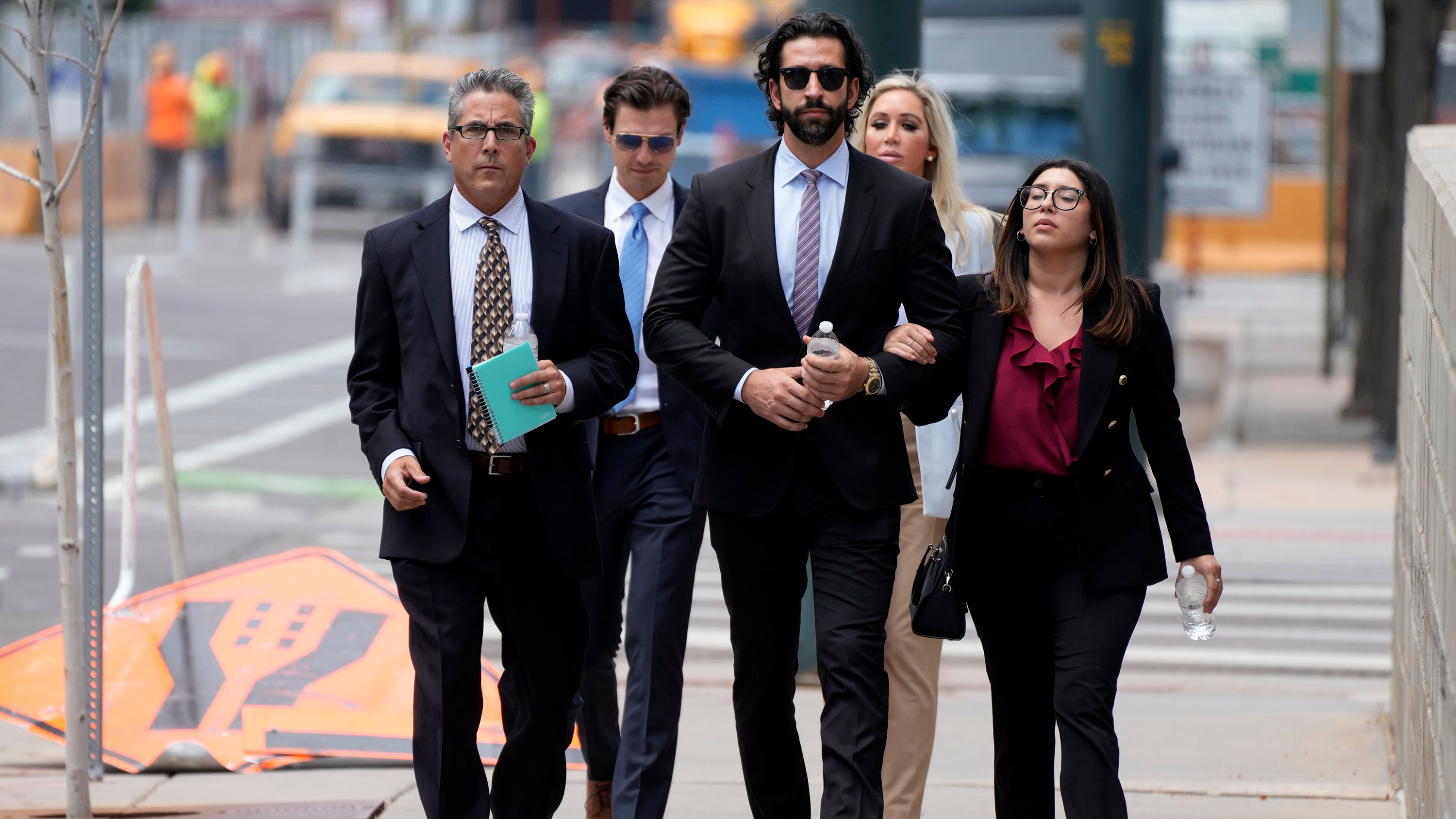 Pittsburgh dentist Lawrence Rudolph's defence investigator heads into federal court in Denver with the dentist's children