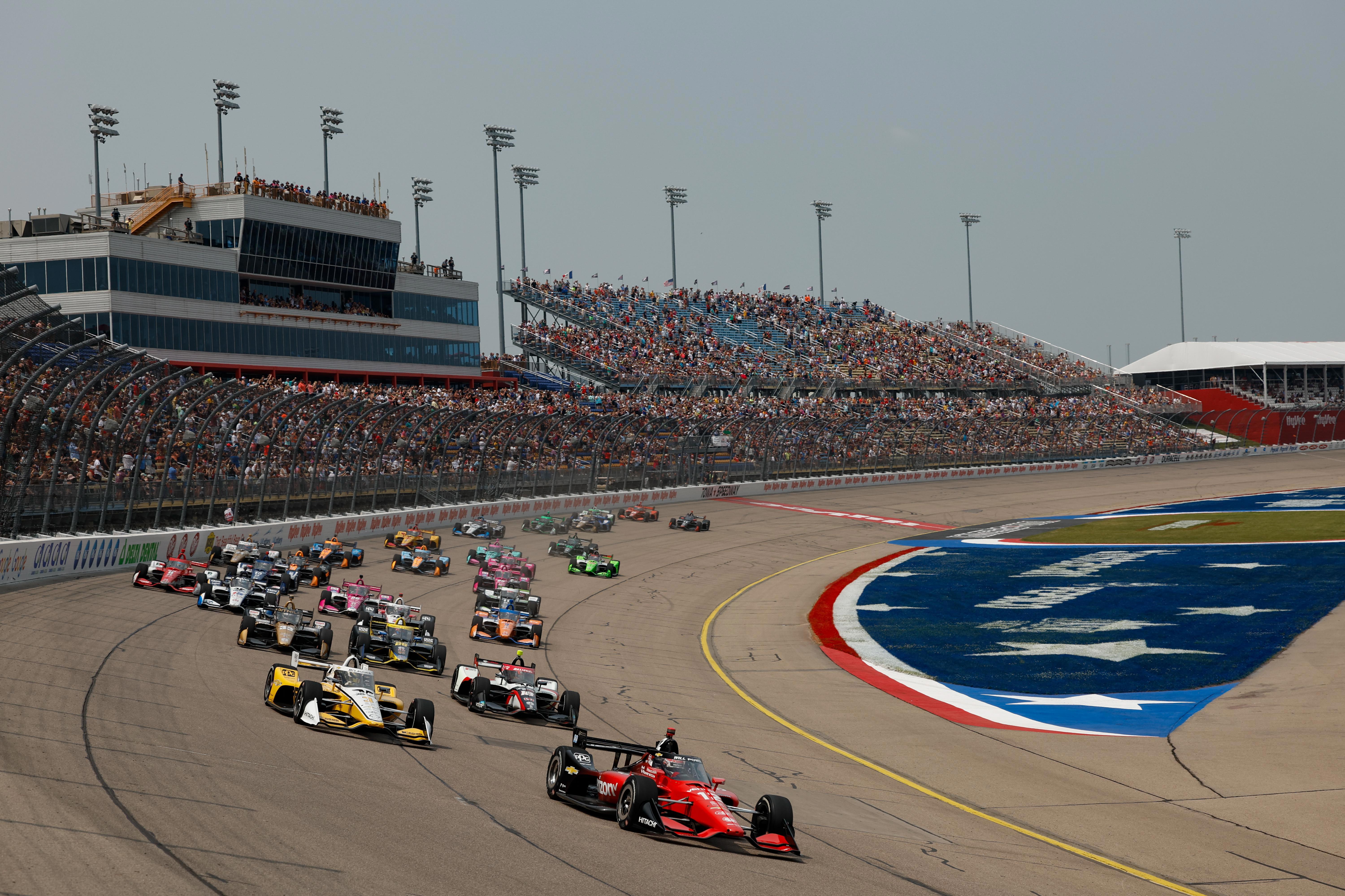 Will Power leads the IndyCar field into turn one at Iowa Speedway.