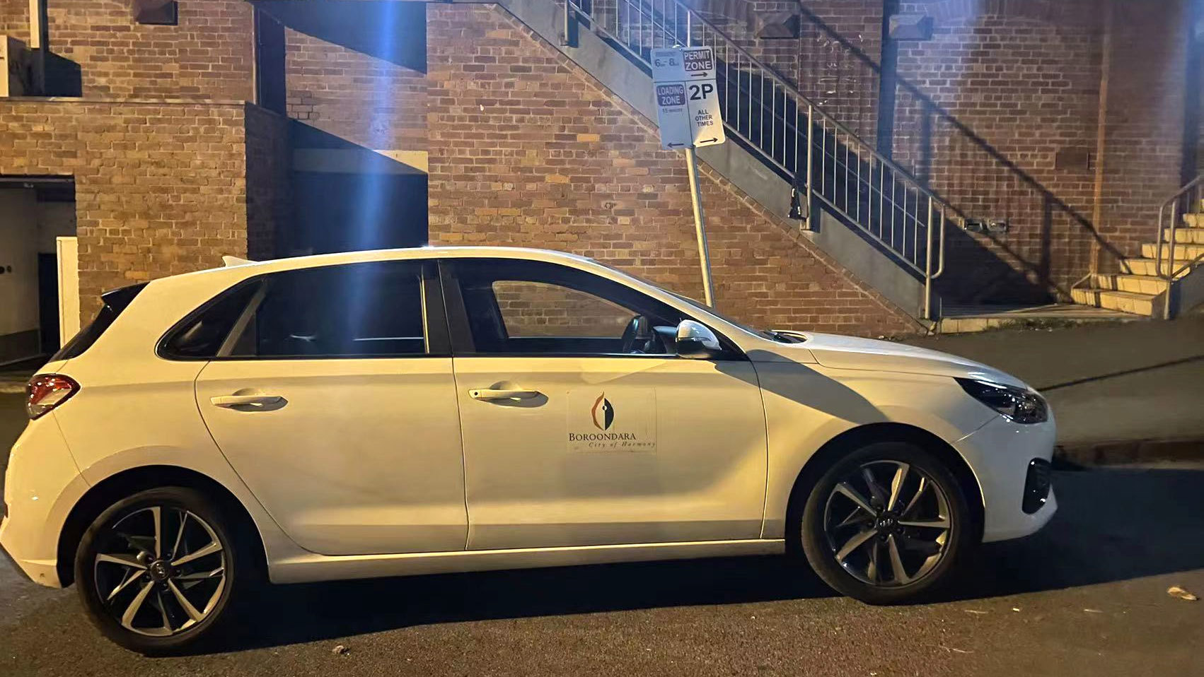 A photo showing a Boroondara City Council ranger's car parked in a loading zone.