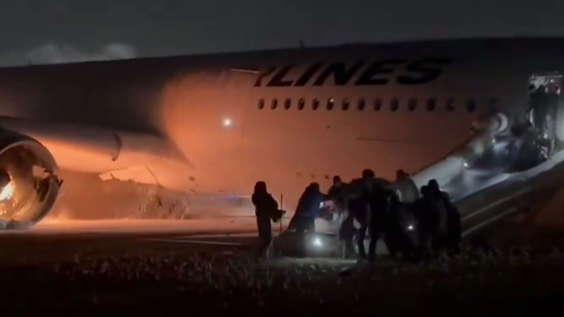 Passengers fleeing the Japan aircraft.