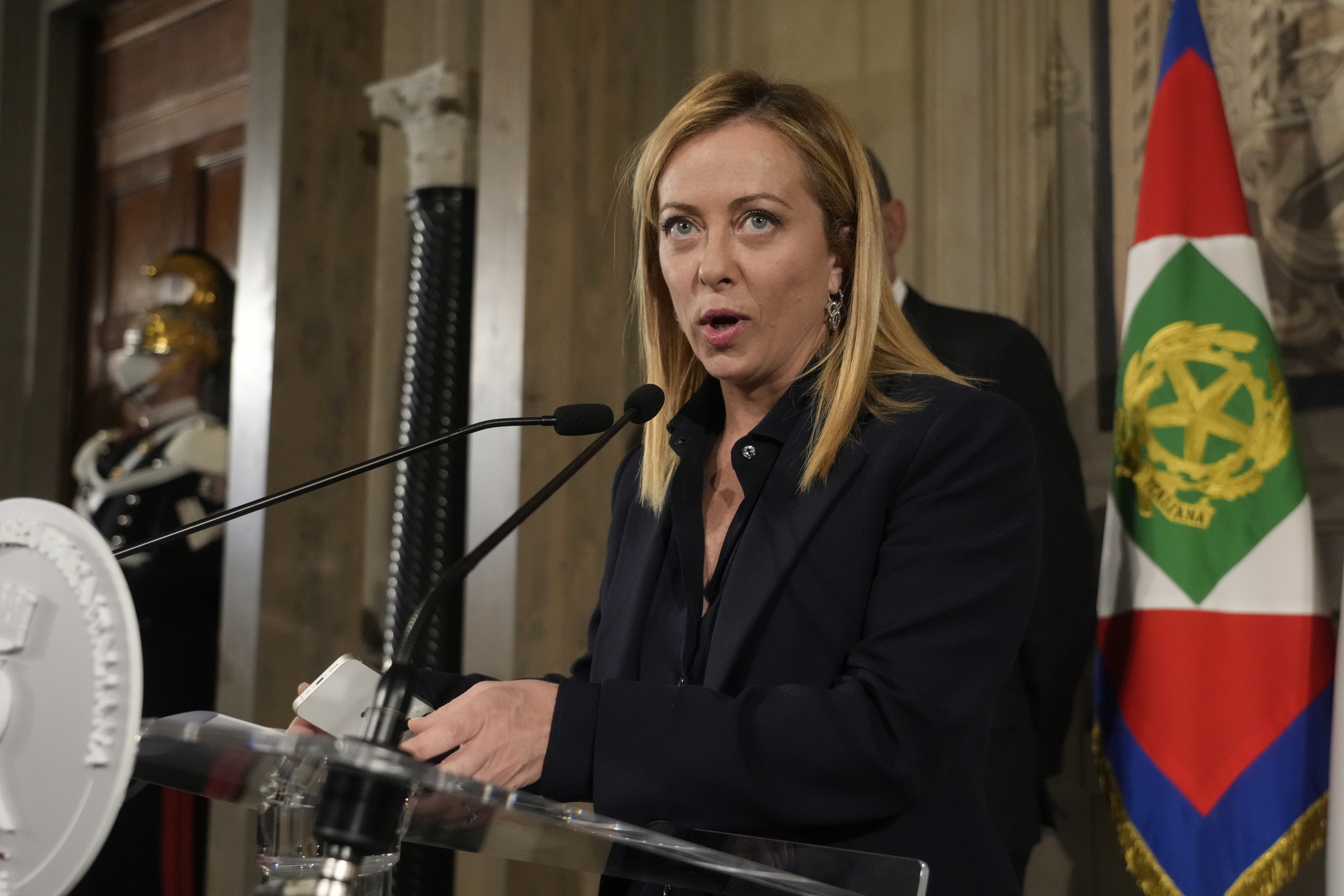 Brothers of Italy's leader Giorgia Meloni reads to the media the list of the ministers of Italy's new government after presenting it to Italian President Sergio Mattarella, at the Quirinale Presidential Palace, in Rome, Friday, Oct. 21, 2022.