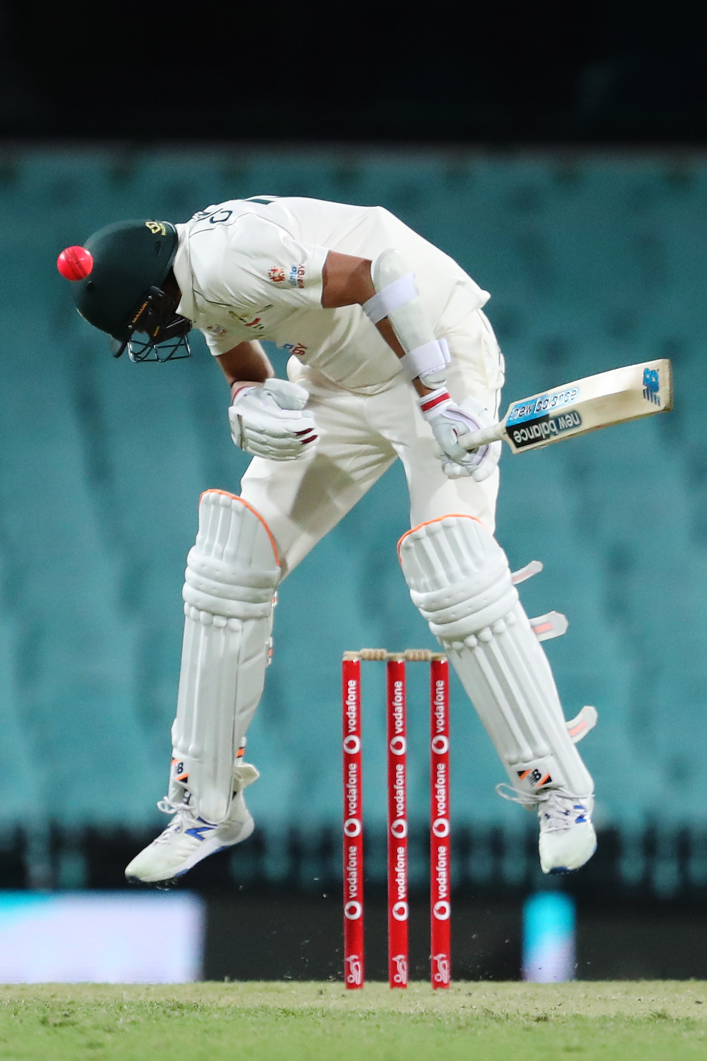 Harry Conway of Australia A is hit on the helmet.