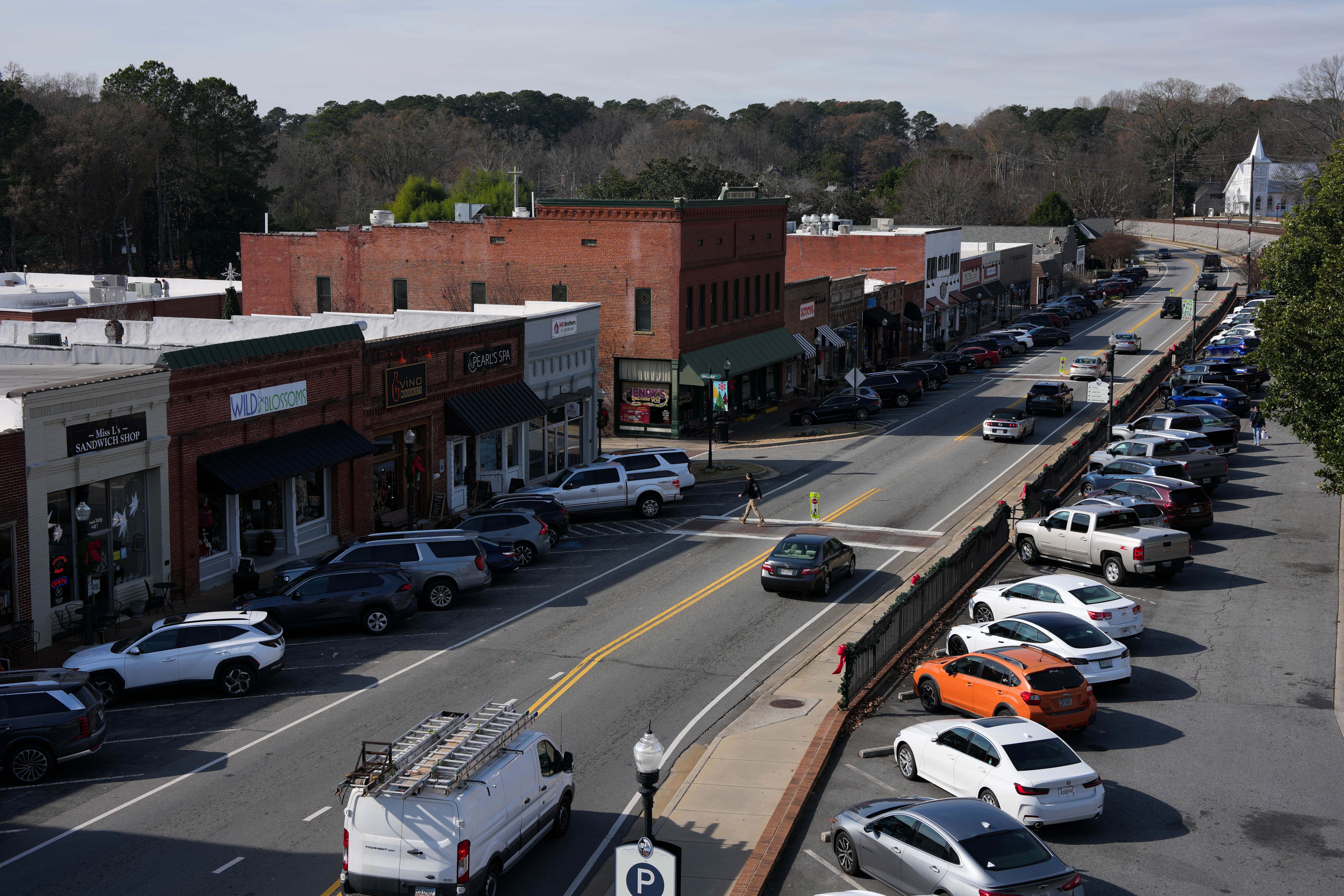 Cars drive through downtown Acworth, Georgia, on December 17, 2025.
