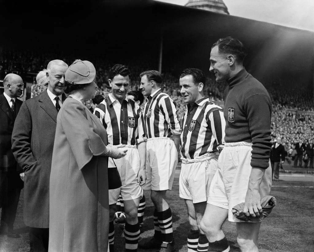 Elizabeth The Queen Mother meets West Bromwich Albion players before the 1954 FA Cup final.
