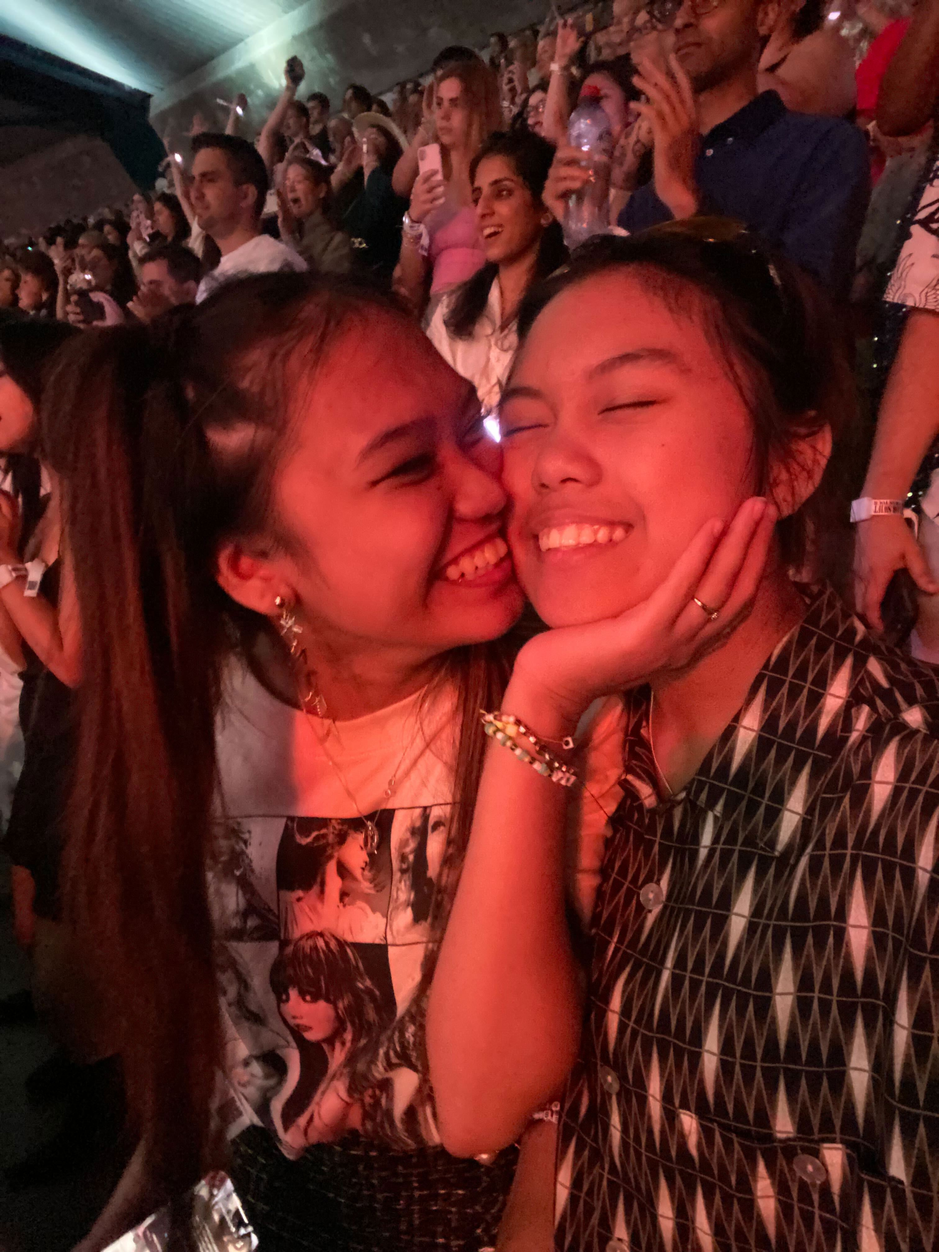 Jules and Kesh smile after getting engaged at a Taylor Swift concert.