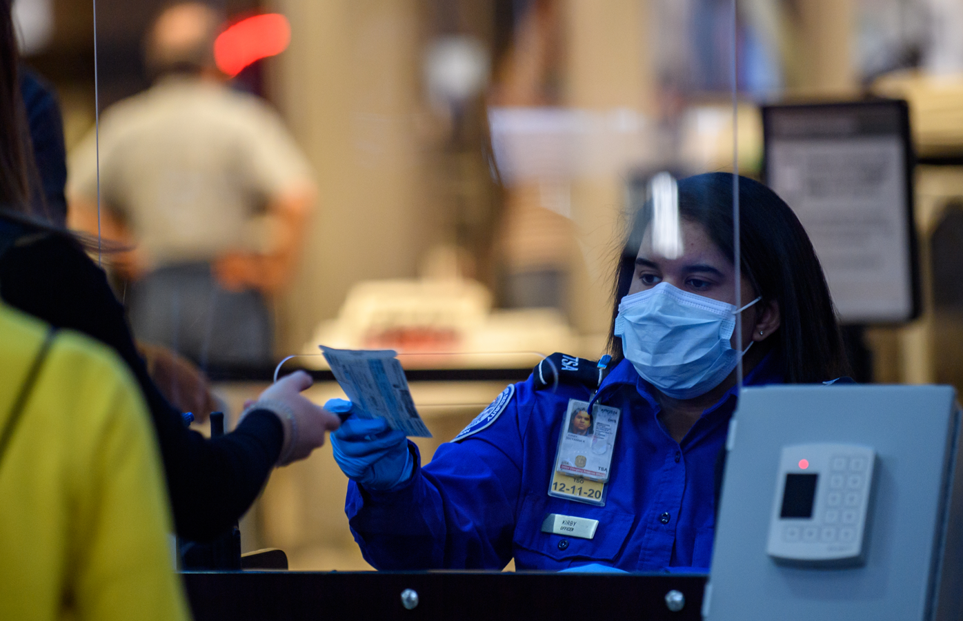 TSA security staff wearing a mask