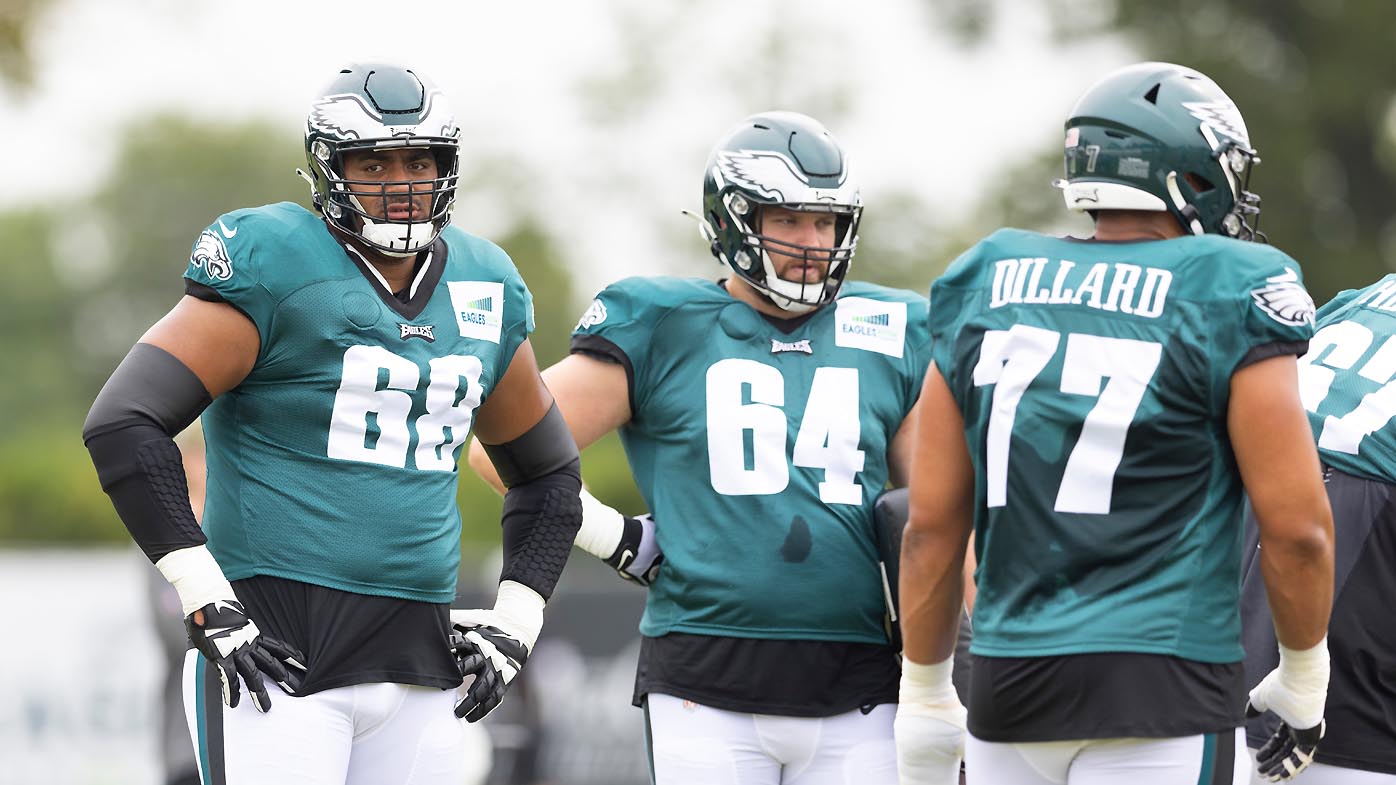 Jordan Mailata #68, Brett Toth #64, and Andre Dillard #77 of the Philadelphia Eagles look on during training camp 