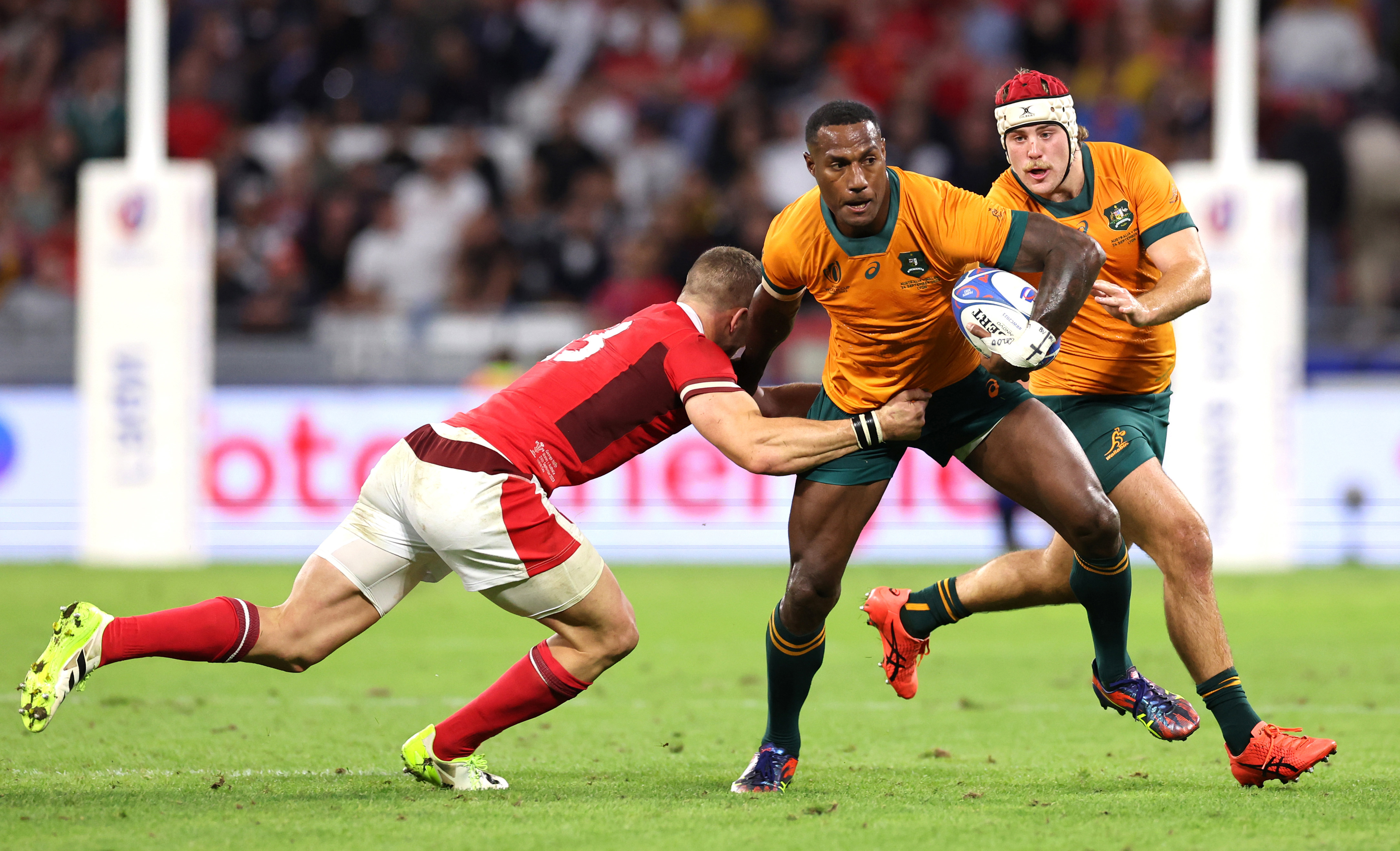 Suliasi Vunivalu of Australia is tackled by George North of Wales.