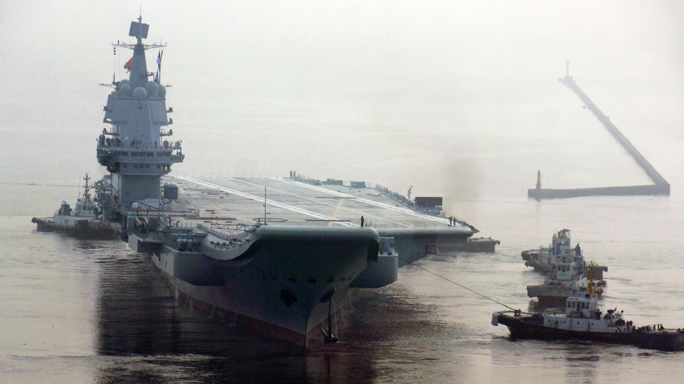 China's first home-built aircraft carrier sets out from a port of Dalian DSIC, in 2018.