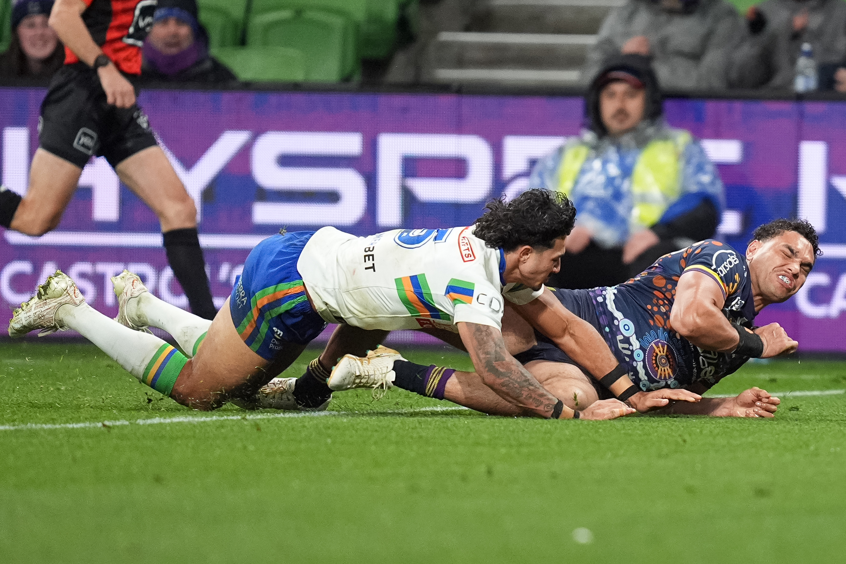 Xavier Coates grimmacing after suffering a hamstring injury while attempting to score a try in the Storm's win over the Raiders.