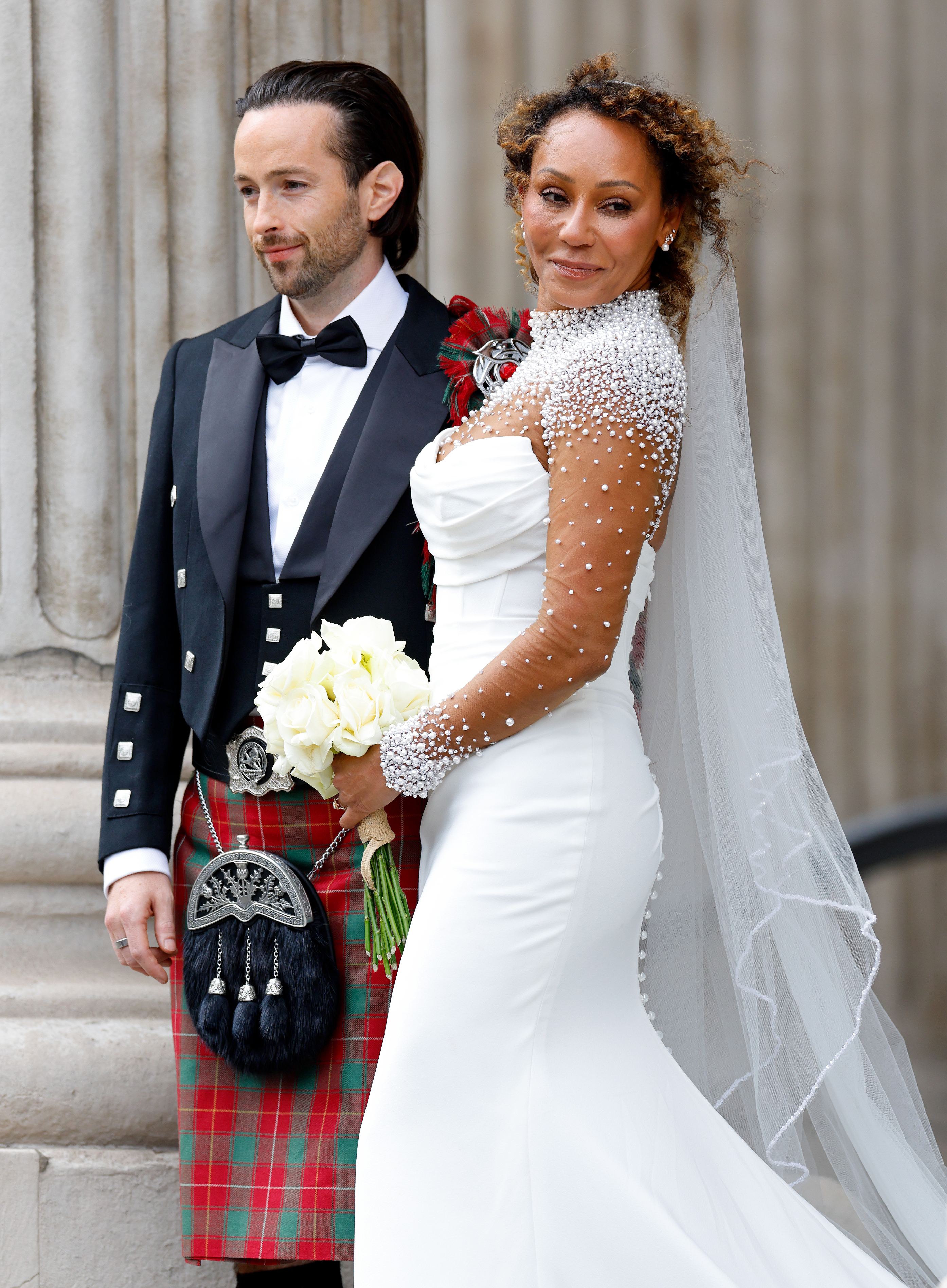 Rory McPhee and Mel B depart following their wedding in the OBE (Order of the British Empire) Chapel at St Paul's Cathedral on July 5, 2025 in London, England. 