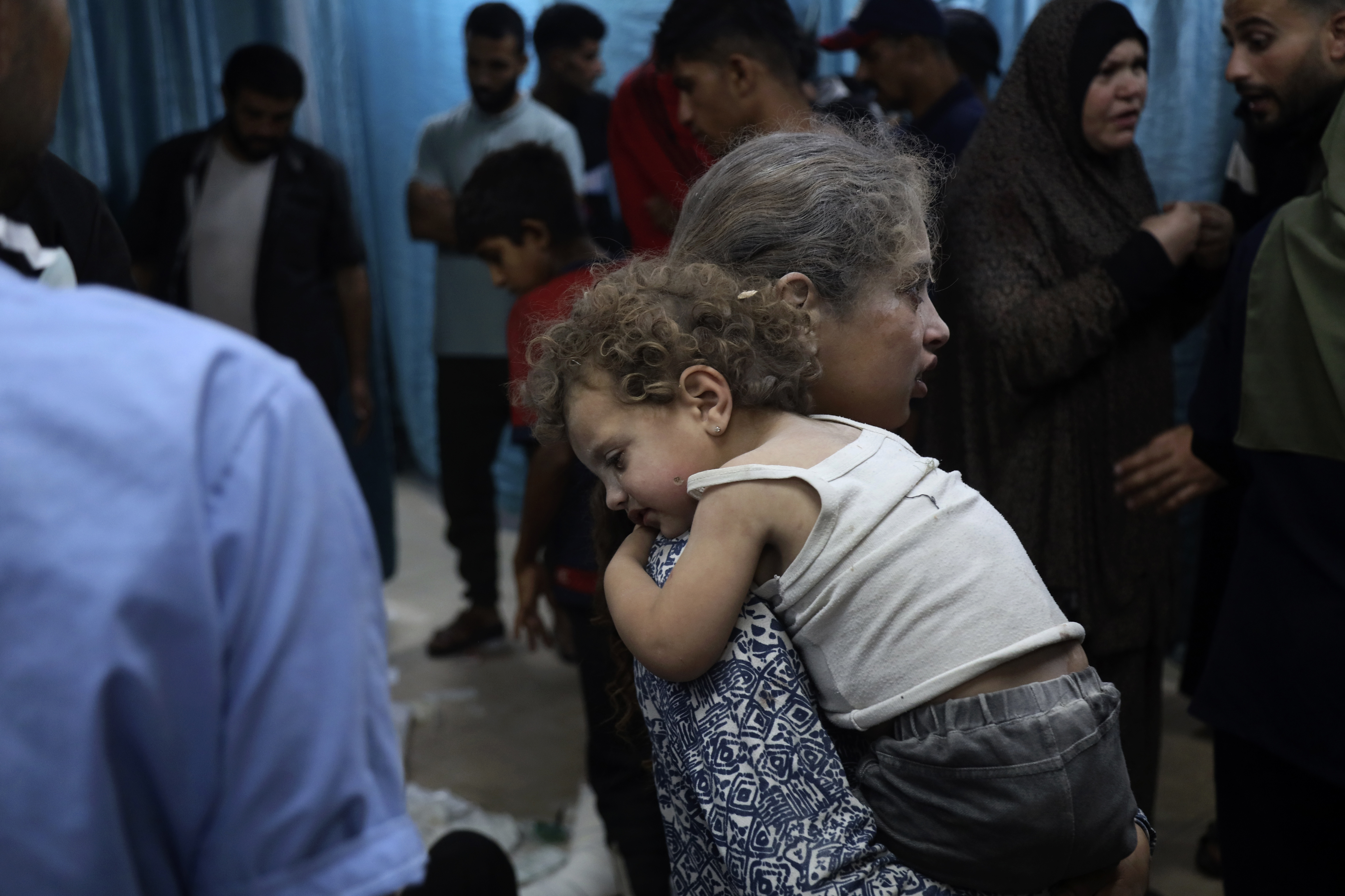 Palestinian children wounded in the Israeli bombardment on a residential building in Bureij refugee camp, are brought to al-Aqsa Martyrs hospital in Deir al-Balah, central Gaza Strip, late Tuesday, June 4, 2024. (AP Photo/Saher Alghorra)