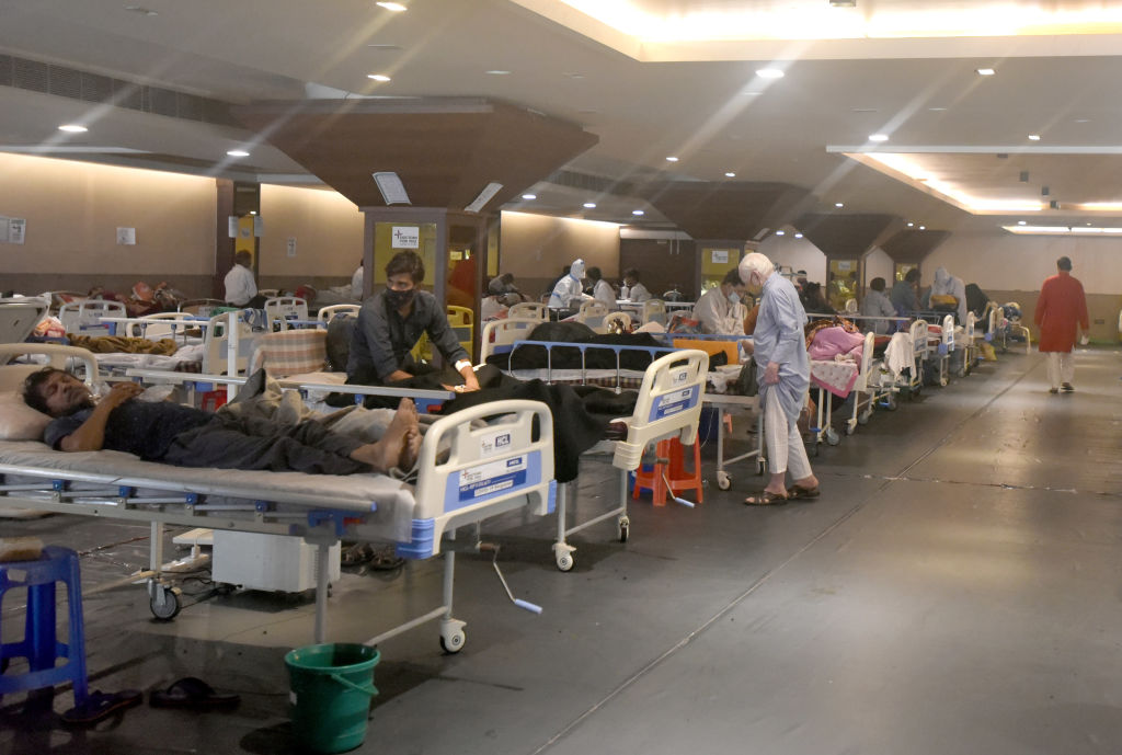 Coronavirus patients relax at Shehnai Banquet Hall Covid-19 care centre, attached to LNJP Hospital  in New Delhi.