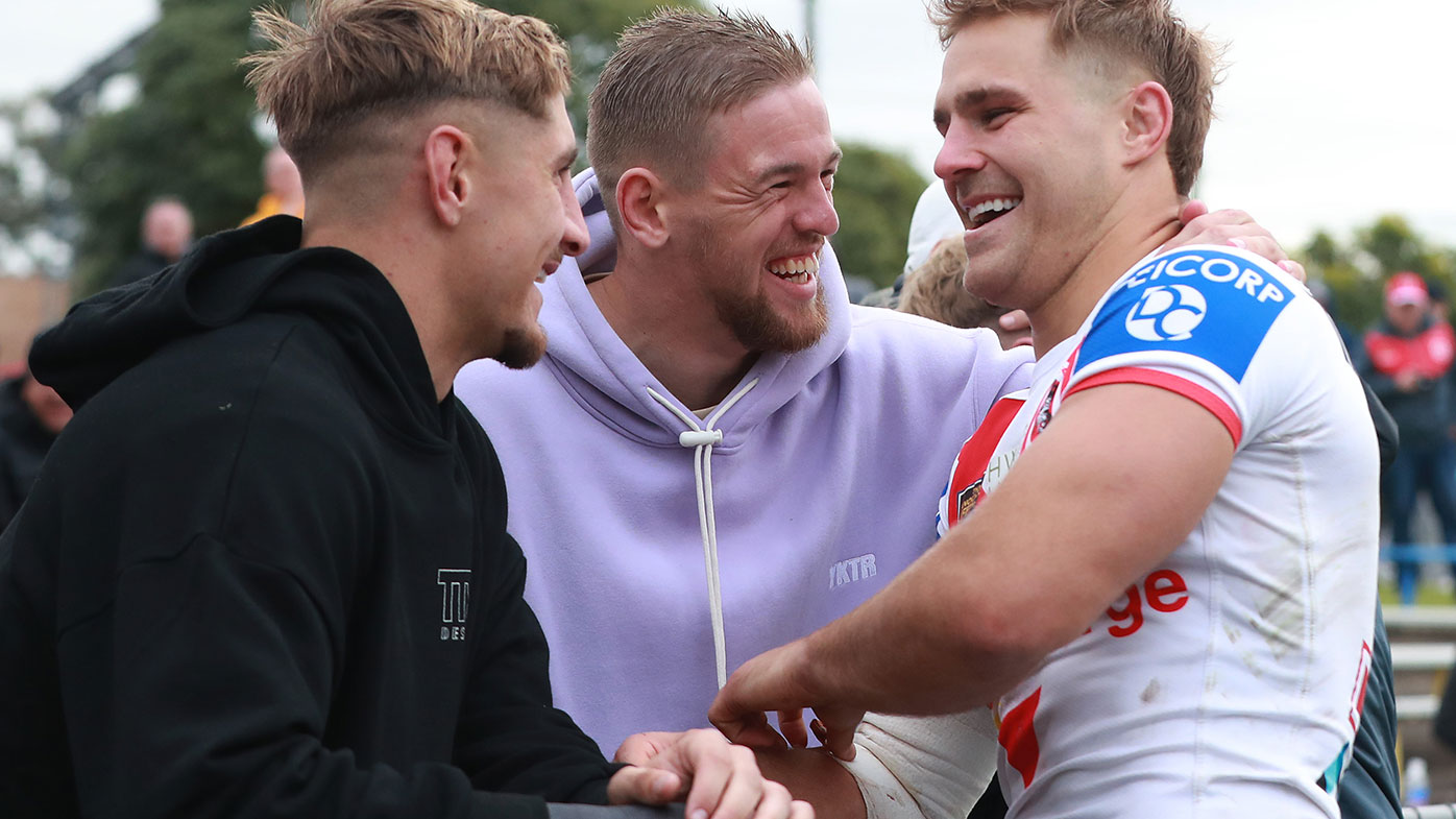 St George Illawarra Dragons player Jack De Belin with his teammates Zac Lomax and Matt Dufty after the NSWRL round 12 match against the Western Suburbs Magpies at Lidcombe Oval on May 29, 2021.