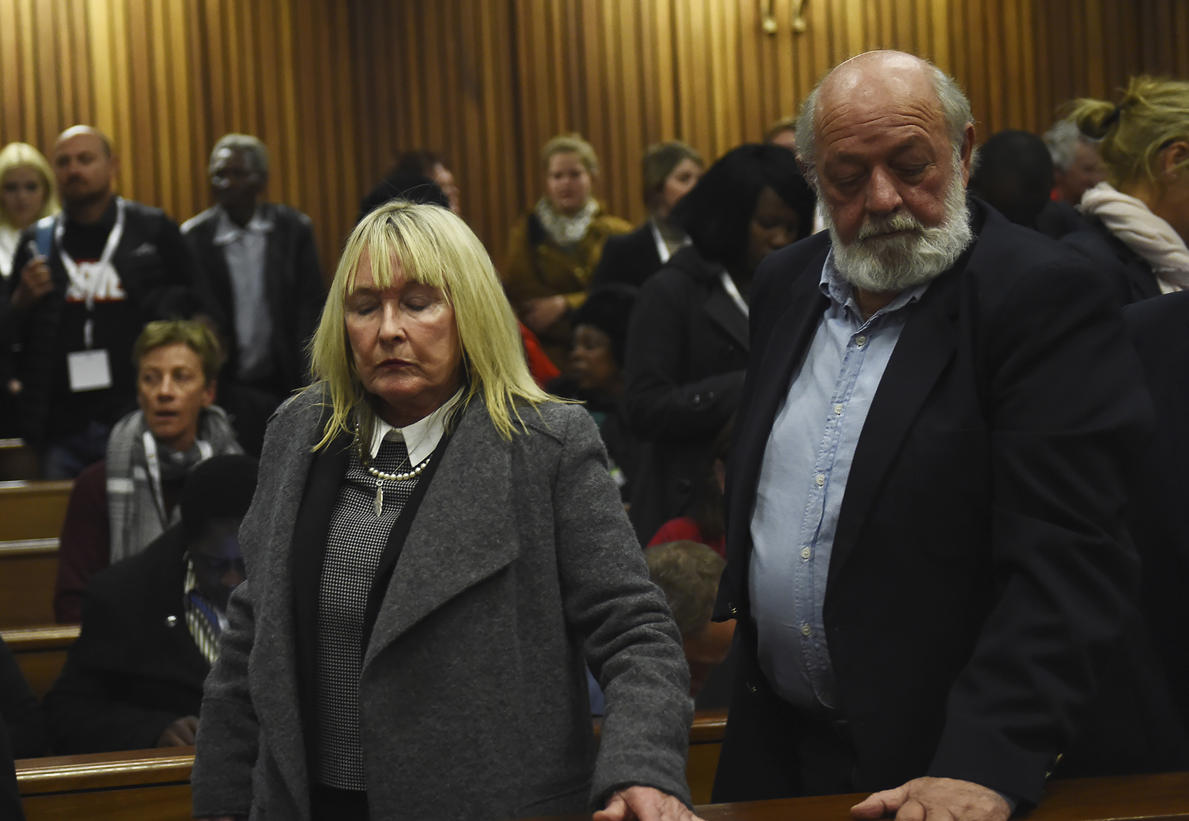 FILE The parents of the late Reeve Steenkamp, June, left, and Barry Steenkamp, right, leave the High Court in Pretoria, South Africa, Wednesday, July 6, 2016. Eight years after he shot dead his girlfriend, Pistorius is up for parole, but first he must meet with her parents, June and Barry Steenkamp, as part of the parole procedure..(Masi Losi, Pool Photo via AP)