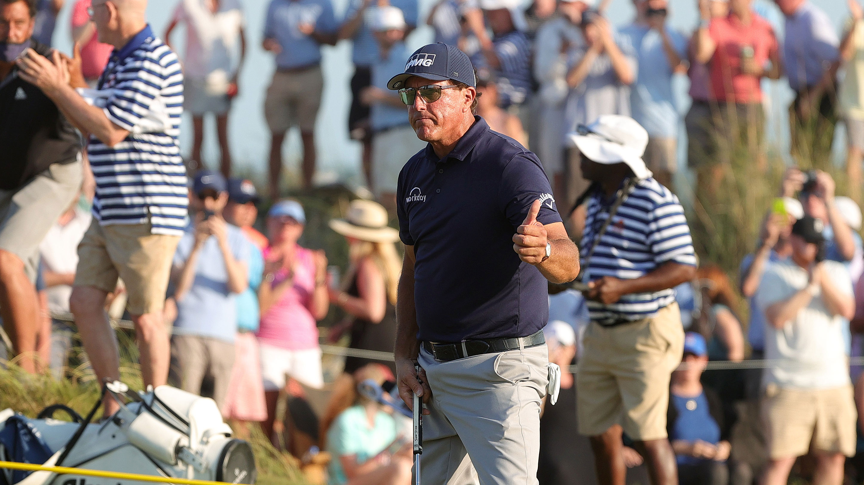 Phil Mickelson gives his trademark thumbs up to the gallery.