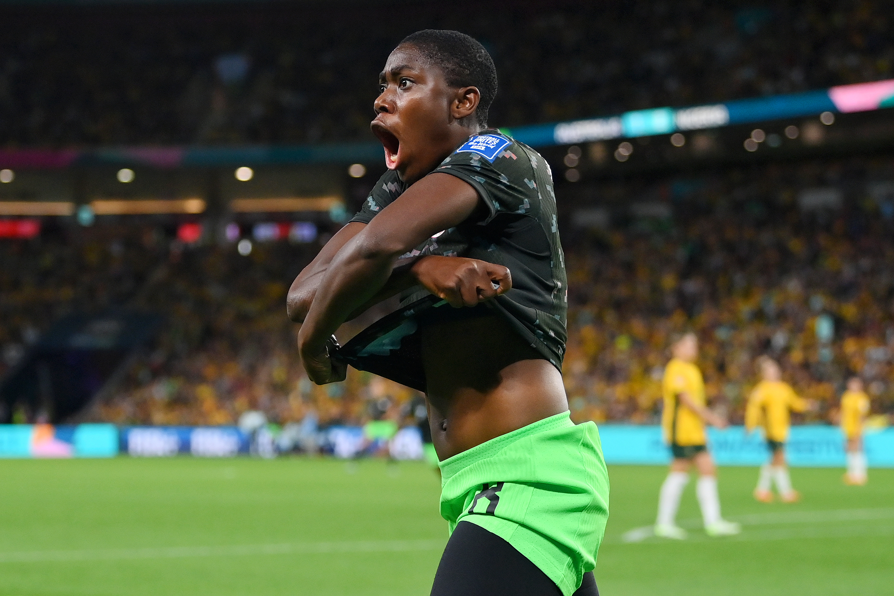 BRISBANE, AUSTRALIA - JULY 27: Asisat Oshoala of Nigeria celebrates after scoring her team's third goal during the FIFA Women's World Cup Australia & New Zealand 2023 Group B match between Australia and Nigeria at Brisbane Stadium on July 27, 2023 in Brisbane, Australia. (Photo by Justin Setterfield/Getty Images)