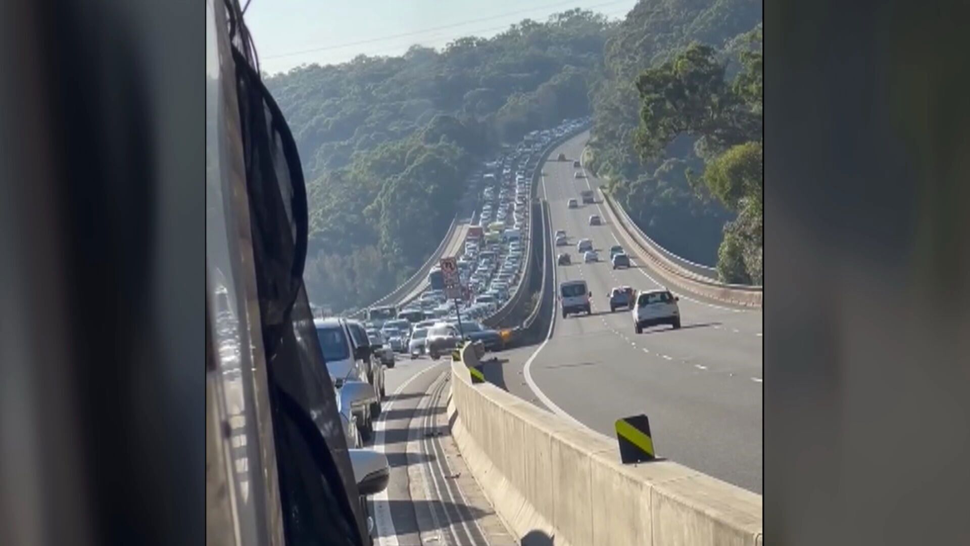 Commuters are experiencing up to an hour and 40 minutes of traffic delays after a man died by crashing his ute in a high-speed police chase in Menai.