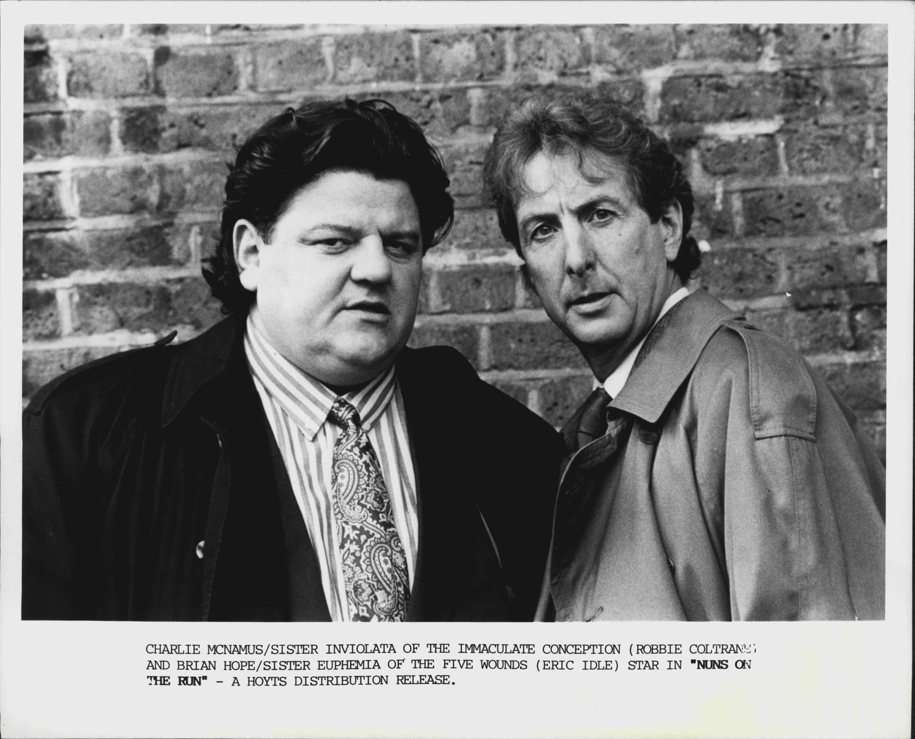 Robbie Coltrane and Eric Idle in "Nuns On The Run" September 20, 1990.