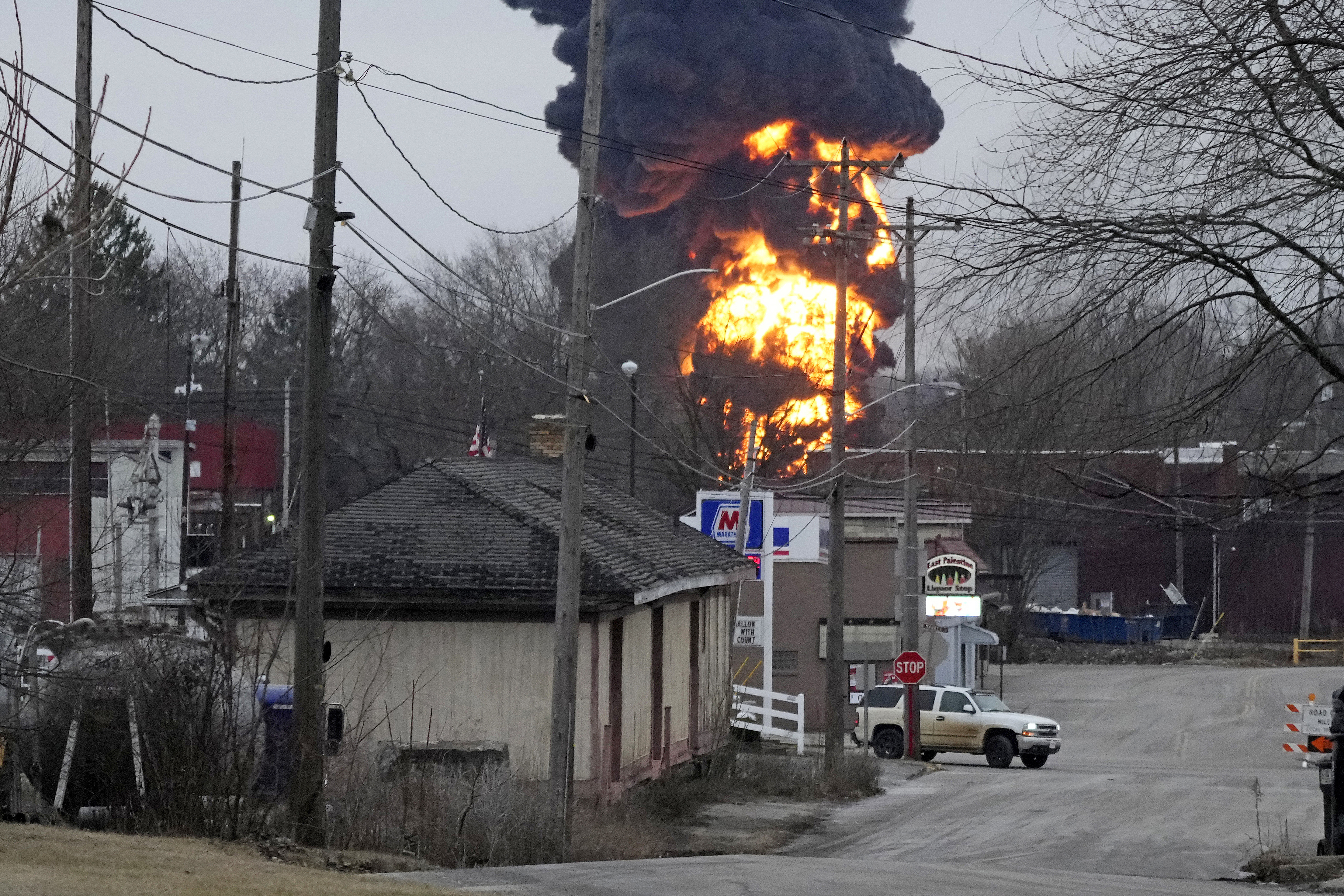 A black plume and fireball rise over East Palestine, Ohio, as a result of a controlled detonation of a portion of the derailed Norfolk Southern trains Monday, Feb. 6, 2023. (AP Photo/Gene J. Puskar)