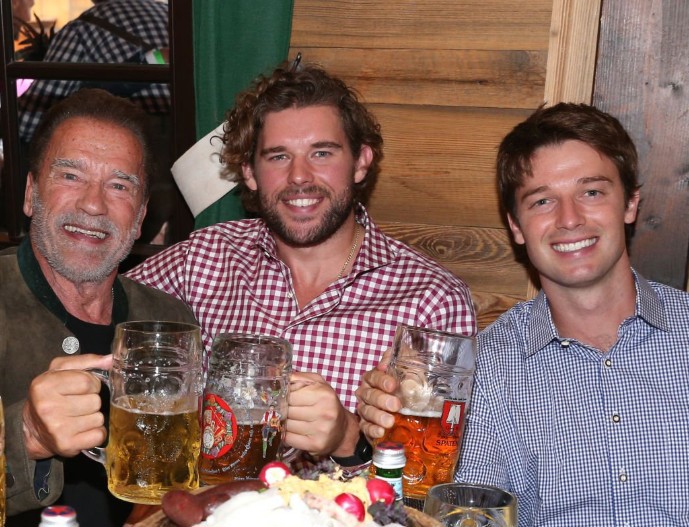 Arnold Schwarzenegger and sons Christopher Schwarzenegger and Patrick at Oktoberfest in Munich, Germany on September 24, 2022.