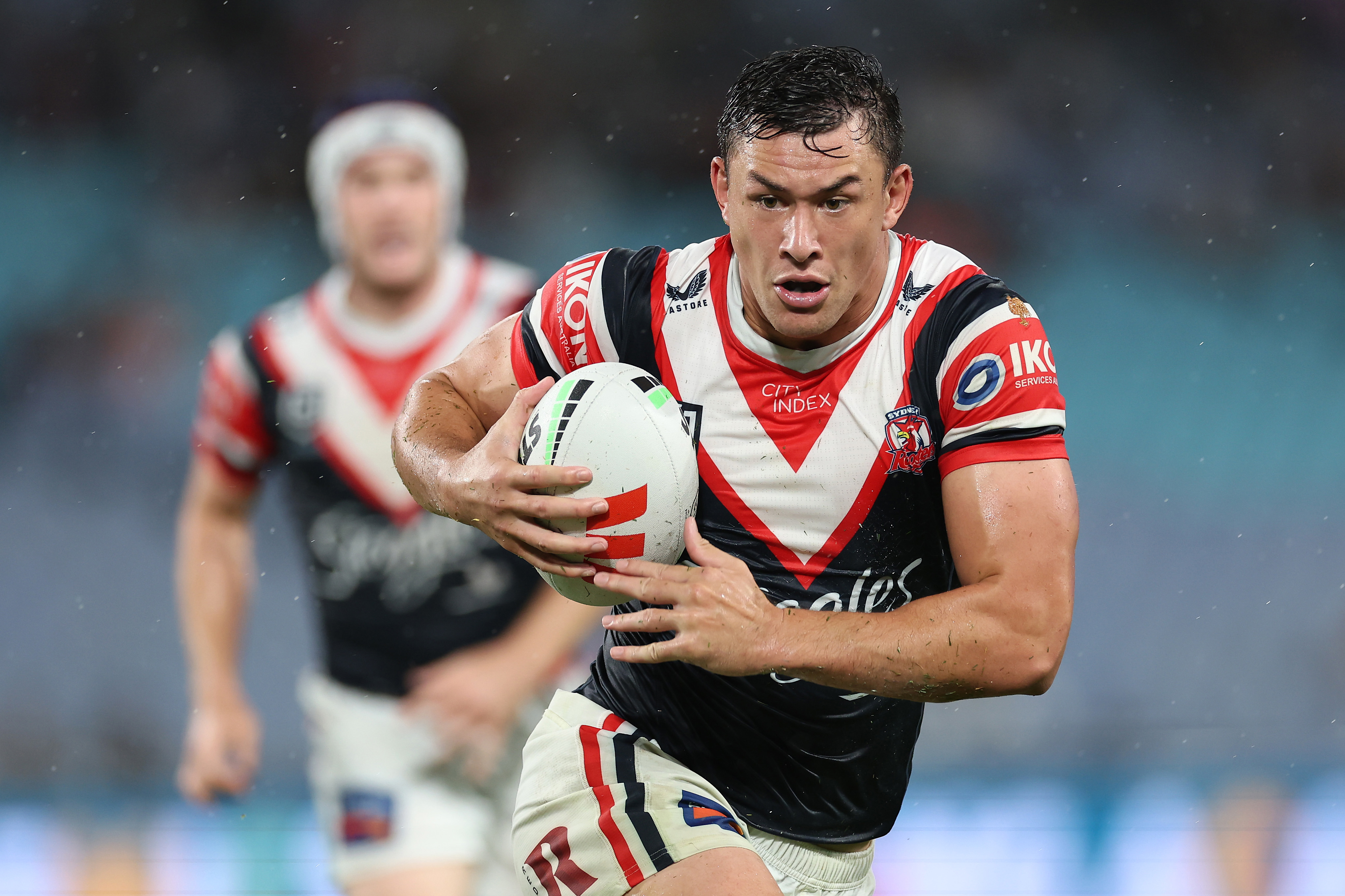 Joseph Manu runs the ball down the line. 