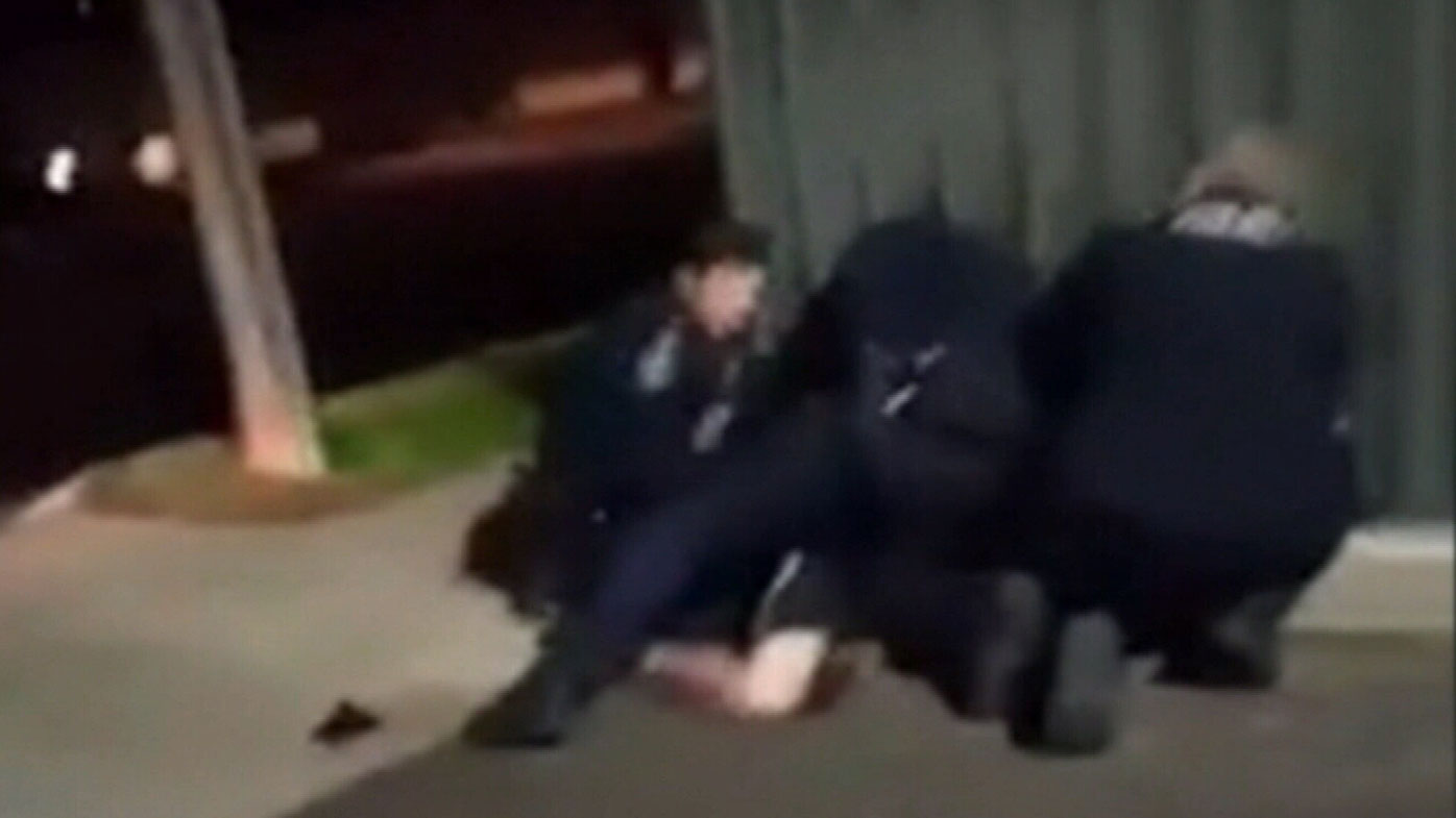 South Australian Police have been filmed pinning a young man to the ground, with claims one officer punched the man during an arrest in Adelaide's inner north.
