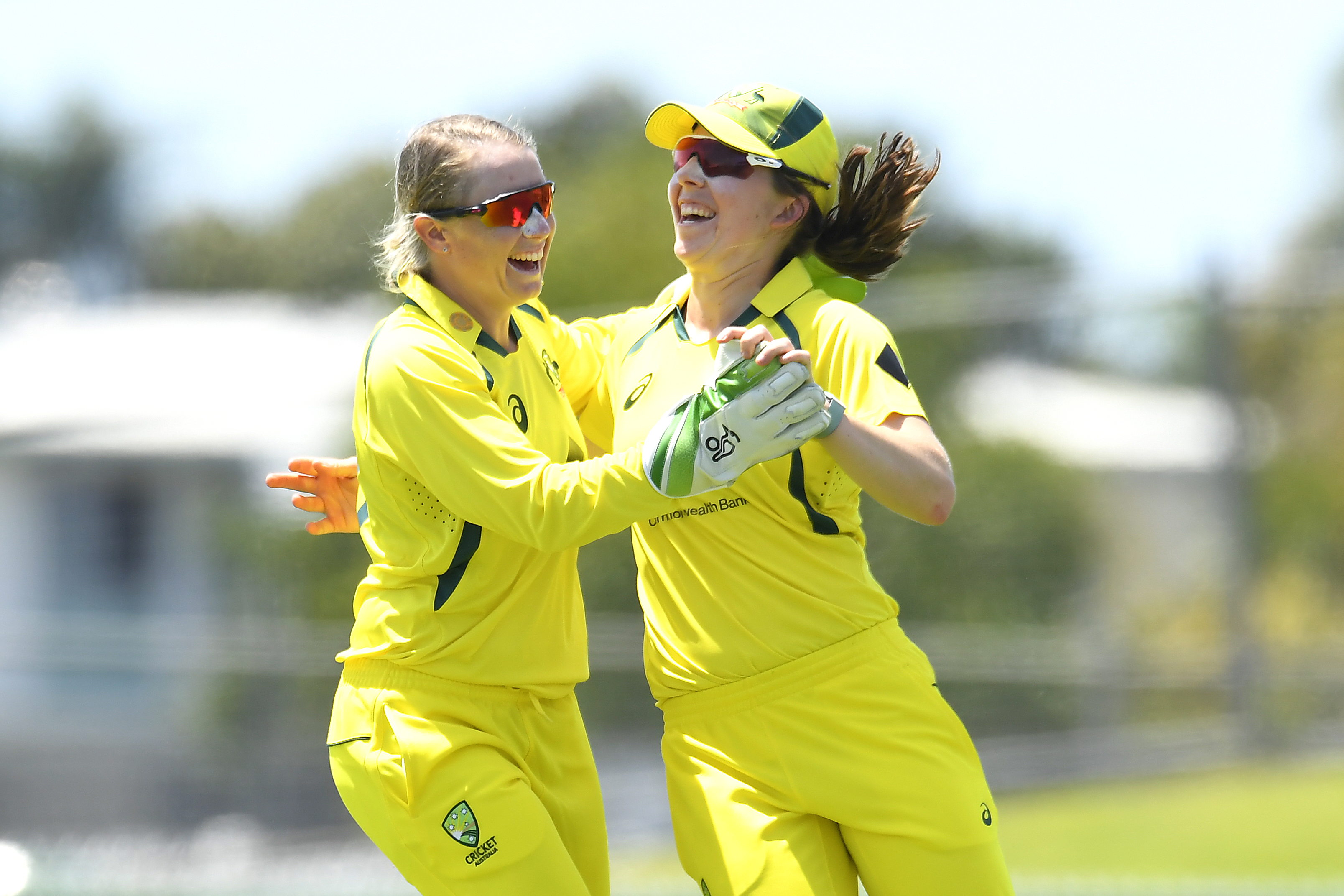Georgia Wareham of Australia celebrates with Alyssa Healy after catching out Deepti Sharma of India.