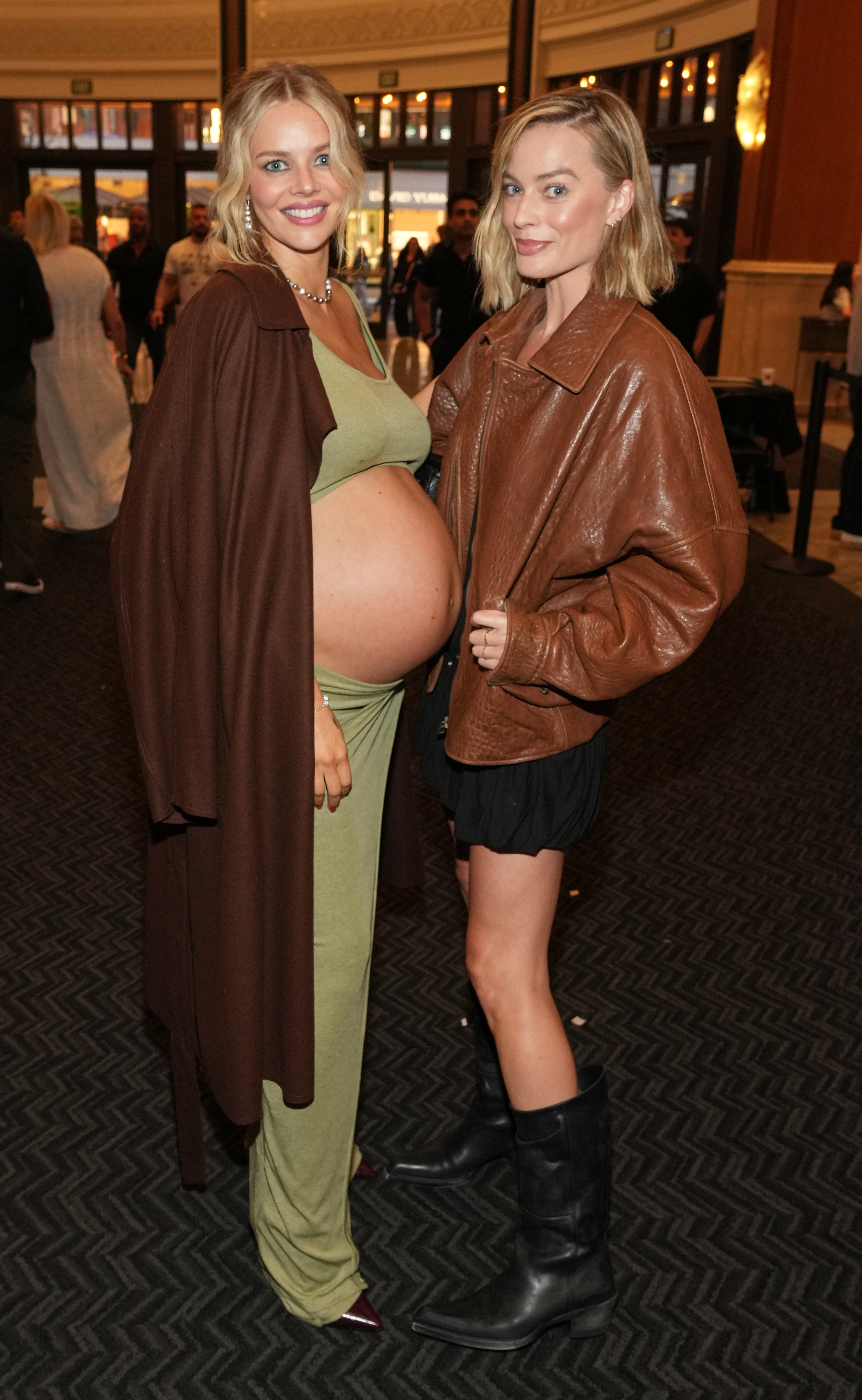Samara Weaving and Margot Robbie at the premiere of Ready or Not 2: Here I Come on Monday, March 16, 2026, at AMC The Grove 14 in Los Angeles. 