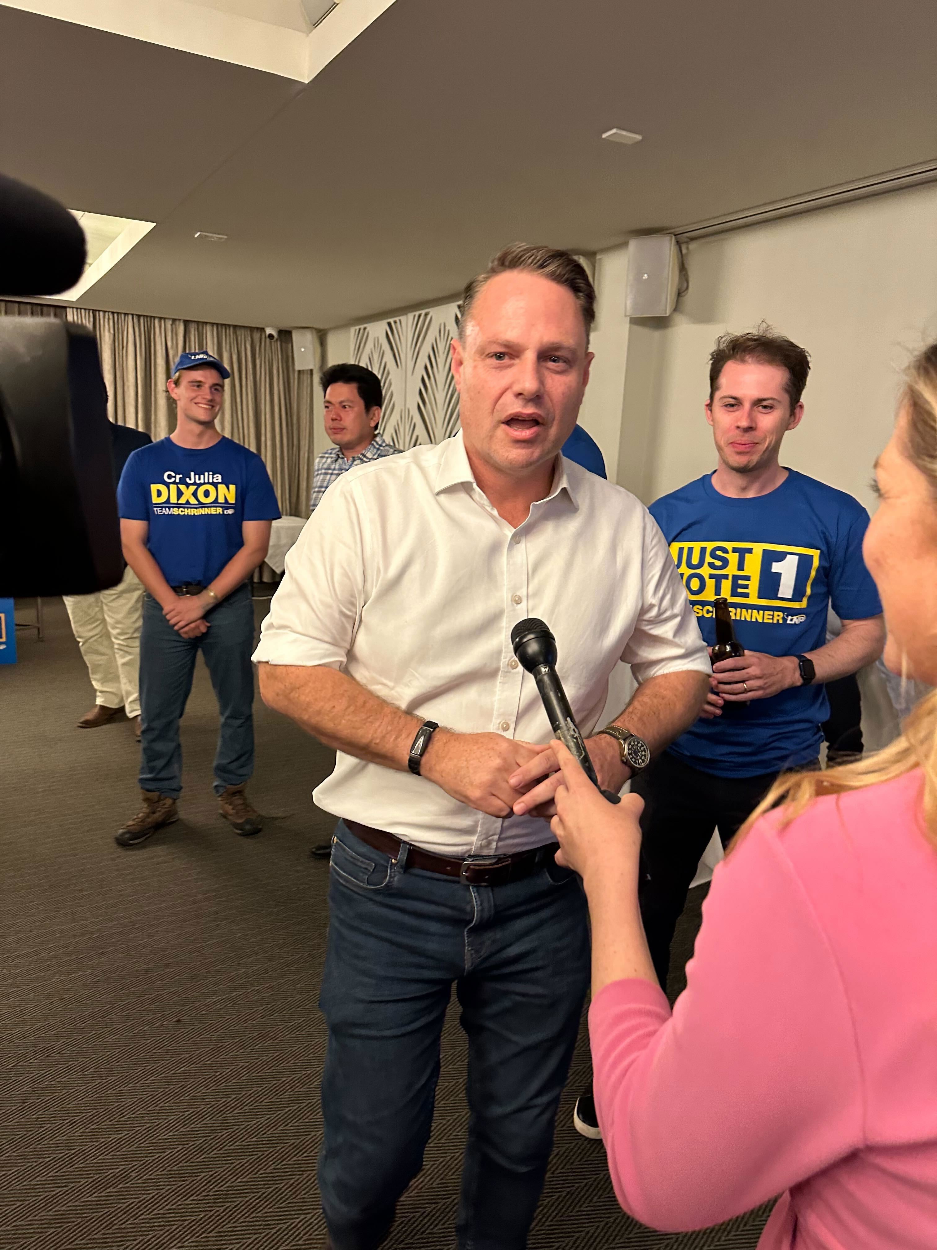 Brisbane Lord Mayor Adrian Schrinner arrives at the LNP's election night function after being re-elected for another four years.