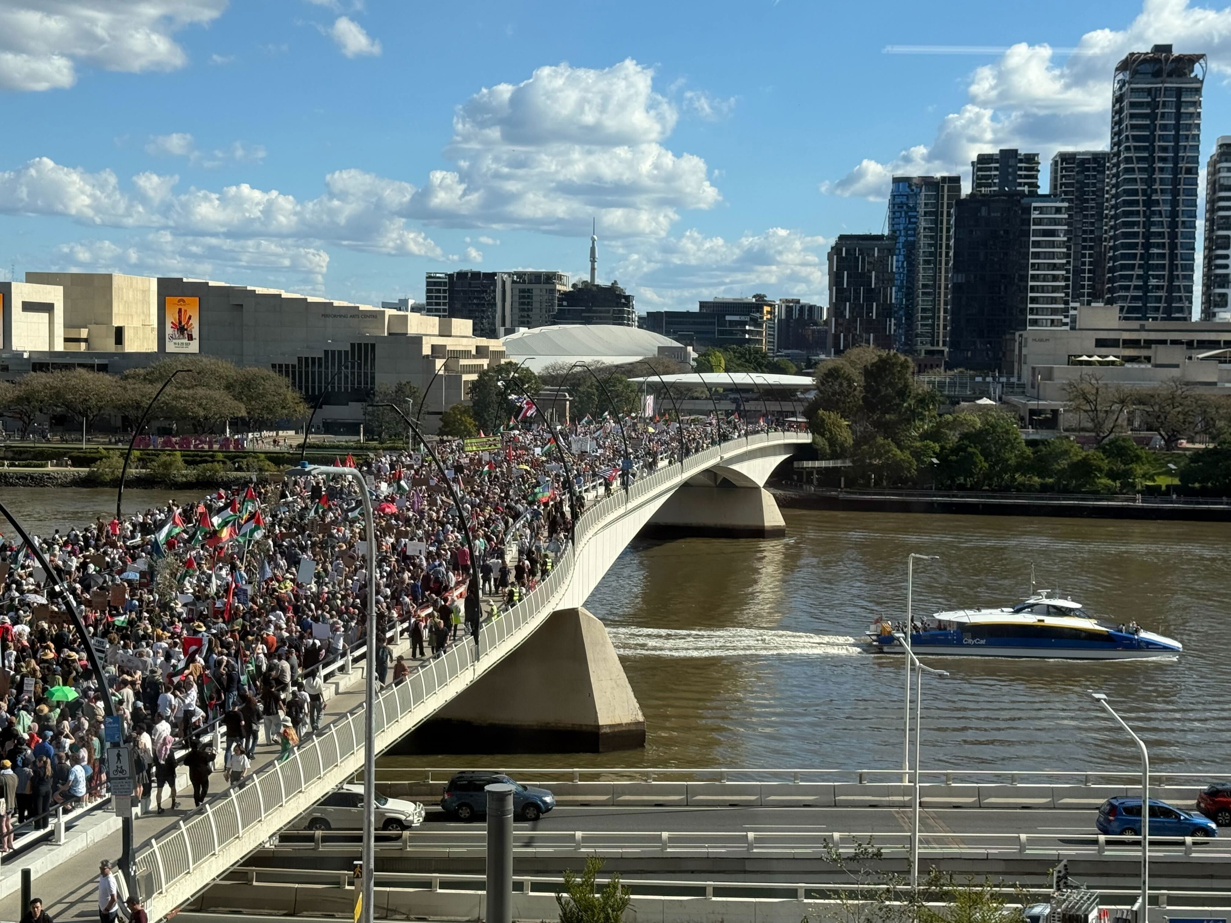 Pro-Palestine protesters march across Brisbane's Victoria Bridge.