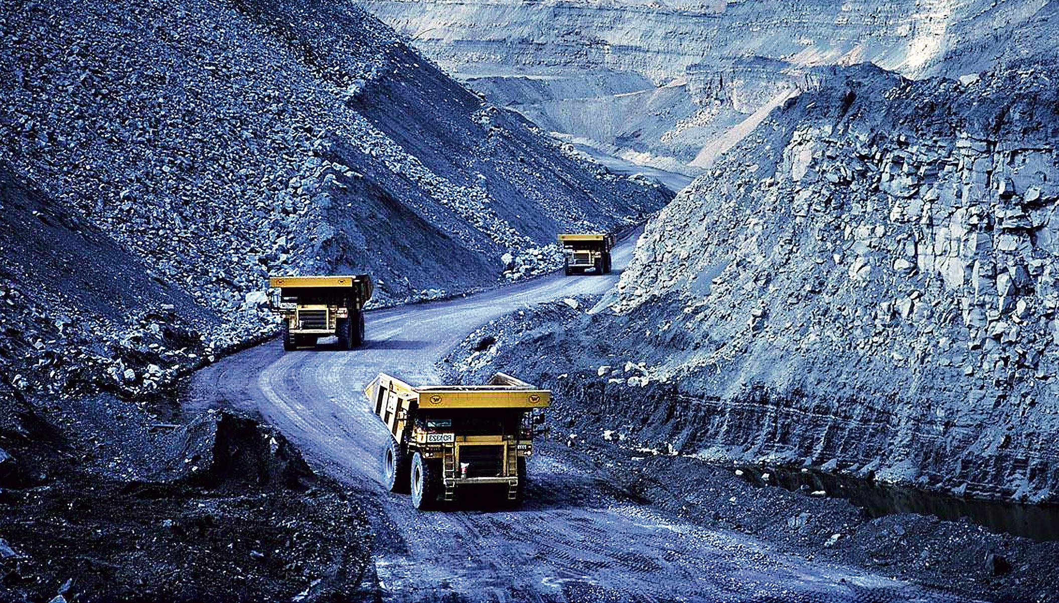 Trucks drive through the Liddell coal mine in NSW.