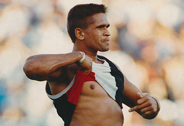 Nicky Winmar bares chest at opposition football fans in 1993 (Wayne Ludbey/The Age)