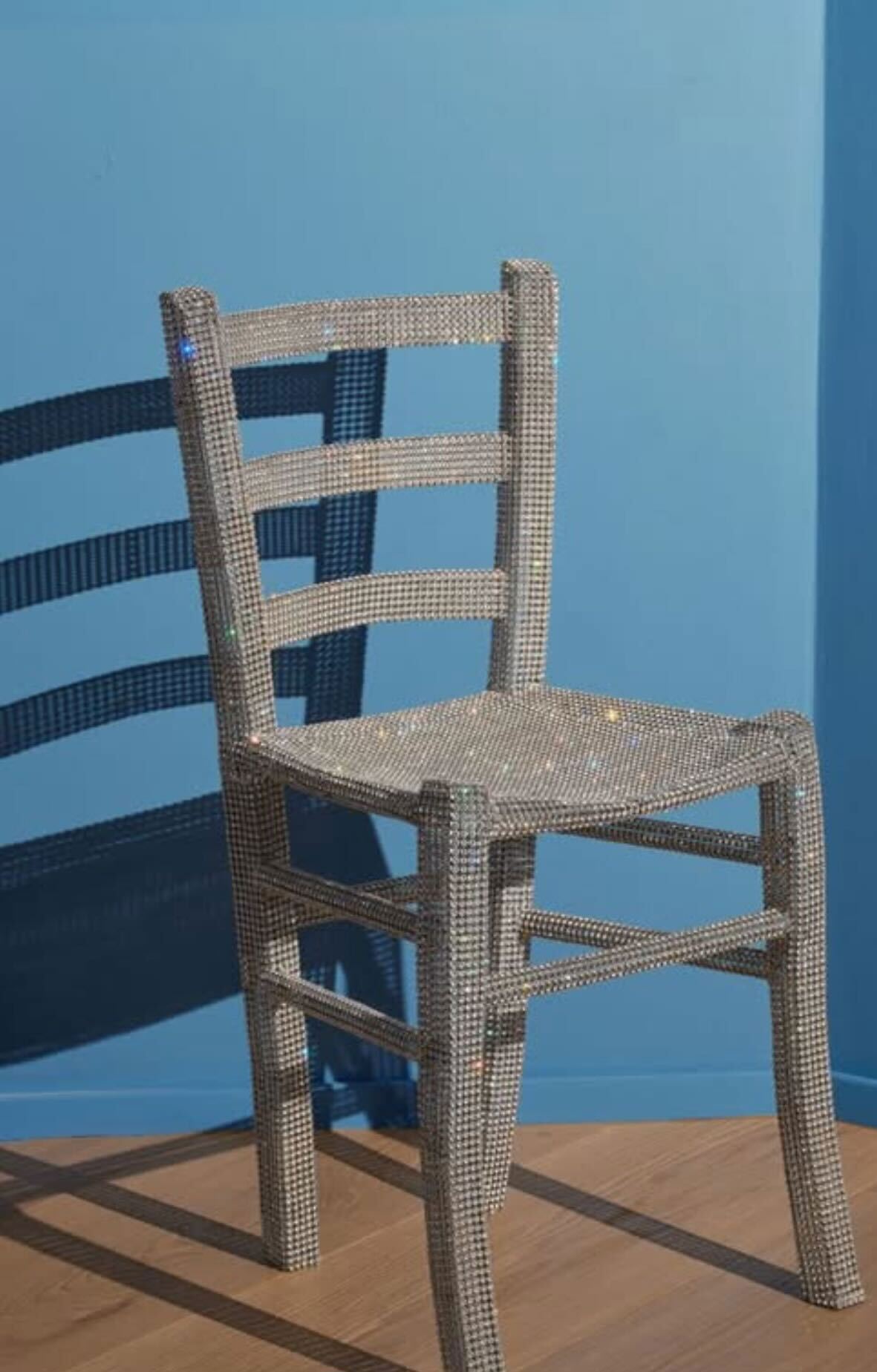 The chair covered in Swarovski crystals, made by artist Nicola Bolla, was in Verona, Italy's Palazzo Maffei Museum. 