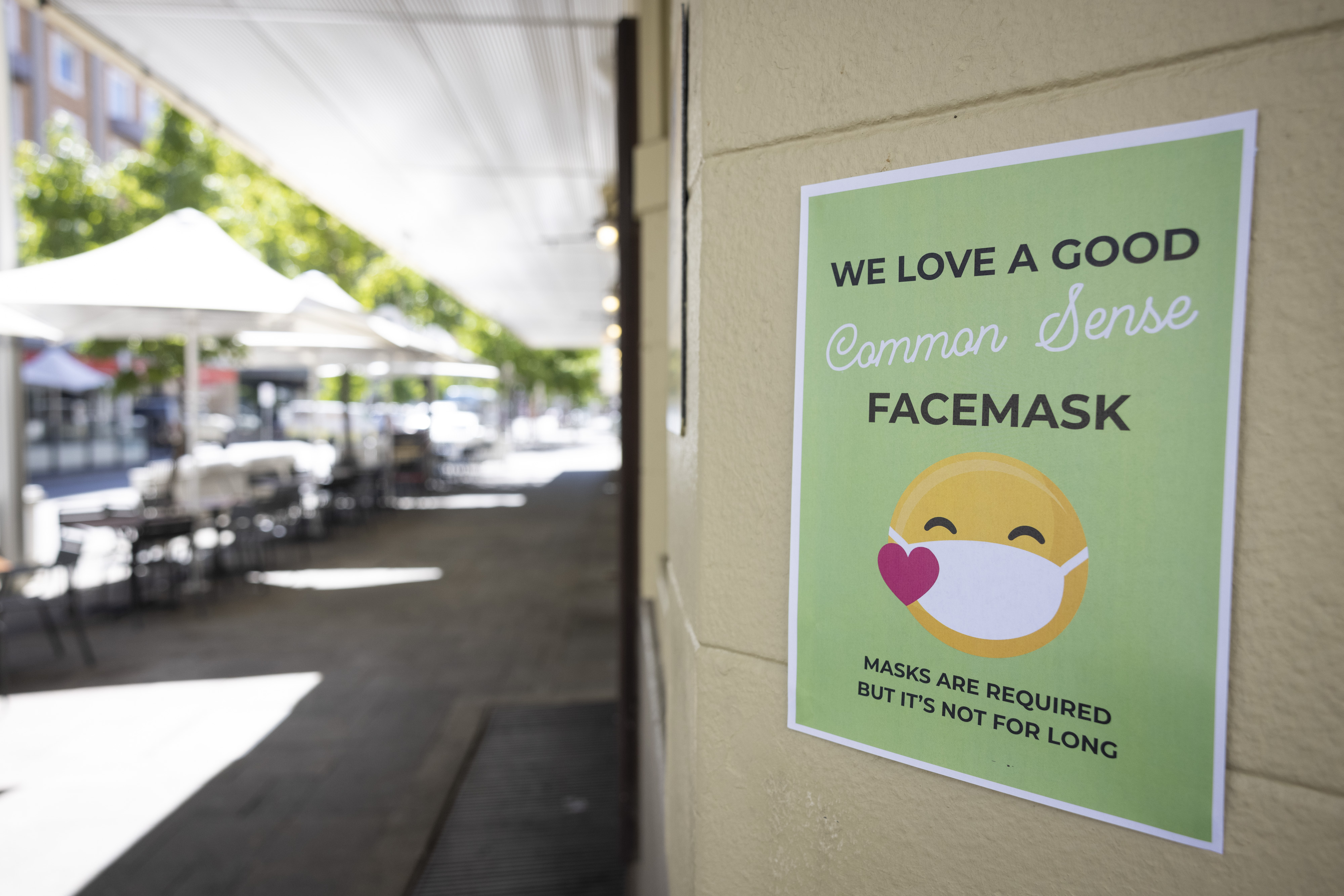 PERTH, AUSTRALIA - DECEMBER 24: A sign on display advises the public to the requirements of face masks on December 24, 2021 in Perth, Australia. The Western Australian government has implemented new COVID-19 restrictions, following the detection of a new community COVID-19 case. From 6pm on Thursday, masks will be mandatory in all public indoor settings in the Perth and Peel regions until December 28th. Authorities are also recommending people wear masks outdoors when physical distance can't be 