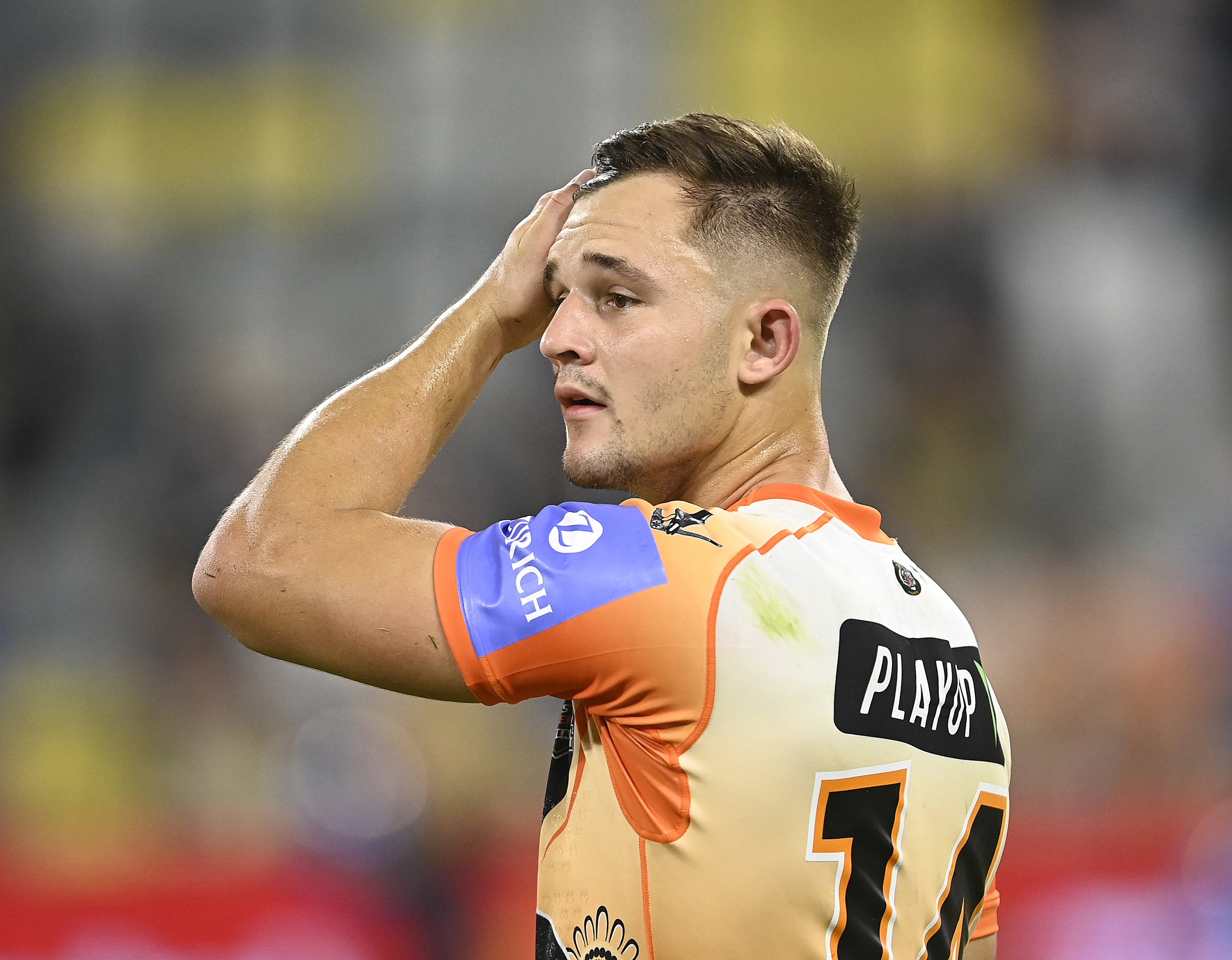 Jake Simpkin of the Tigers looks dejected after losing  the round 12 NRL match between North Queensland Cowboys and Wests Tigers at Qld Country Bank Stadium, on May 24, 2024, in Townsville, Australia. (Photo by Ian Hitchcock/Getty Images)