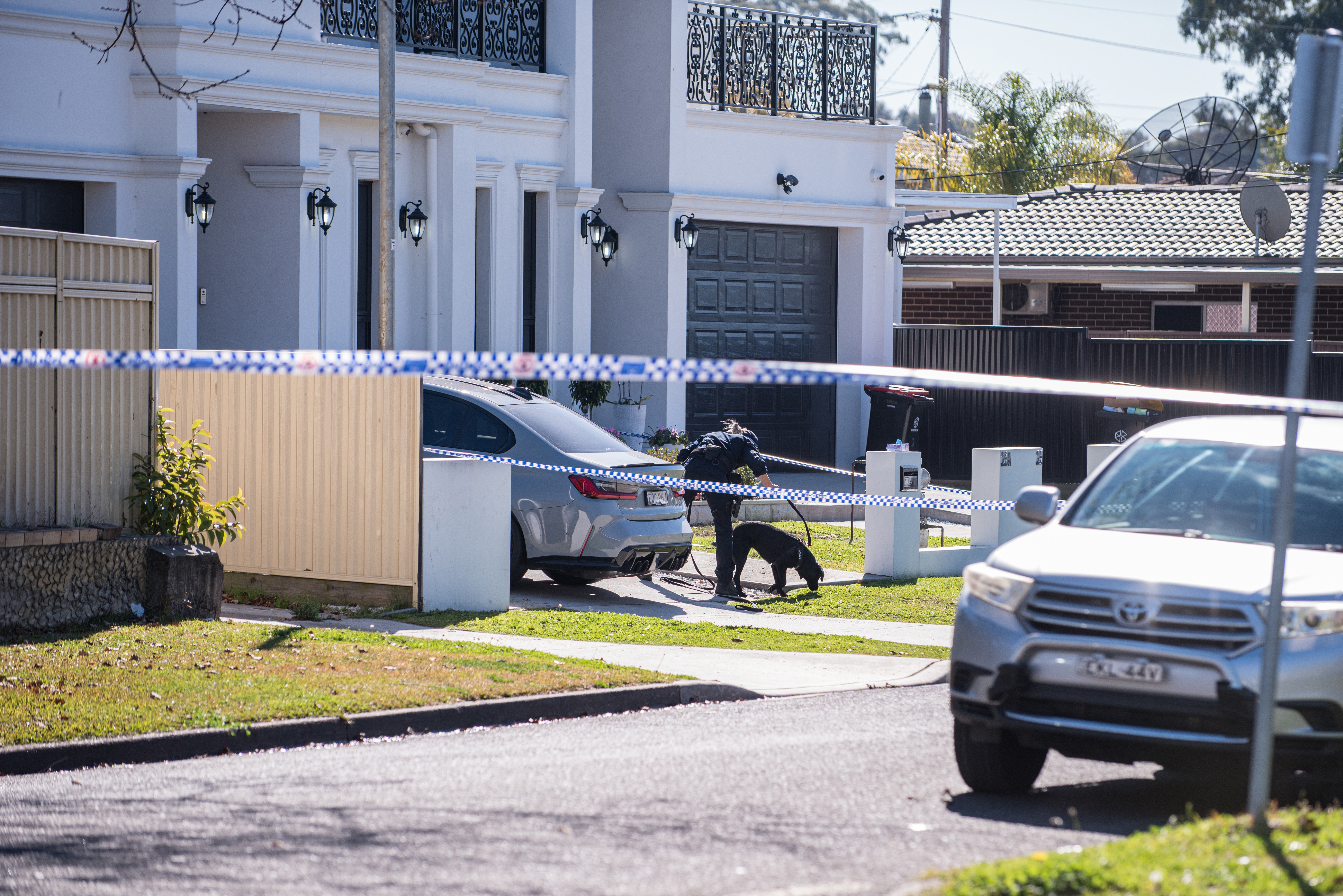 Police investigating after a man was shot outside a Greenacre home this morning in Sydney on July 26, 2023. Photo: Flavio Bracaleone / The Sydney Morning Herald