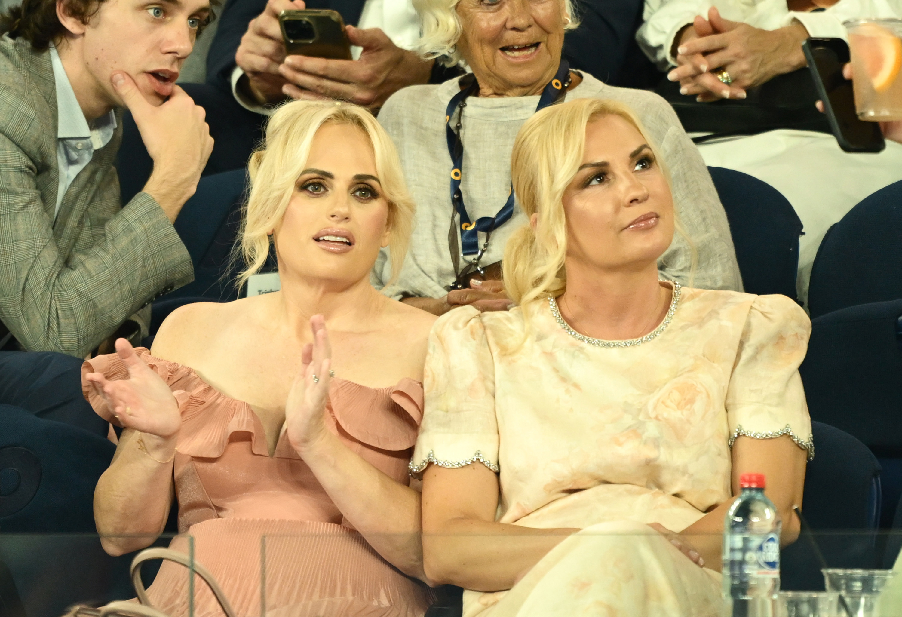 MELBOURNE, AUSTRALIA - JANUARY 12: Rebel Wilson and wife Ramona Agruma watch the Men's Singles First Round match between Alexander Zverev of Germany and Lucas Pouille of France during day one of the 2025 Australian Open at Melbourne Park on January 12, 2025 in Melbourne, Australia. (Photo by Hannah Peters/Getty Images)