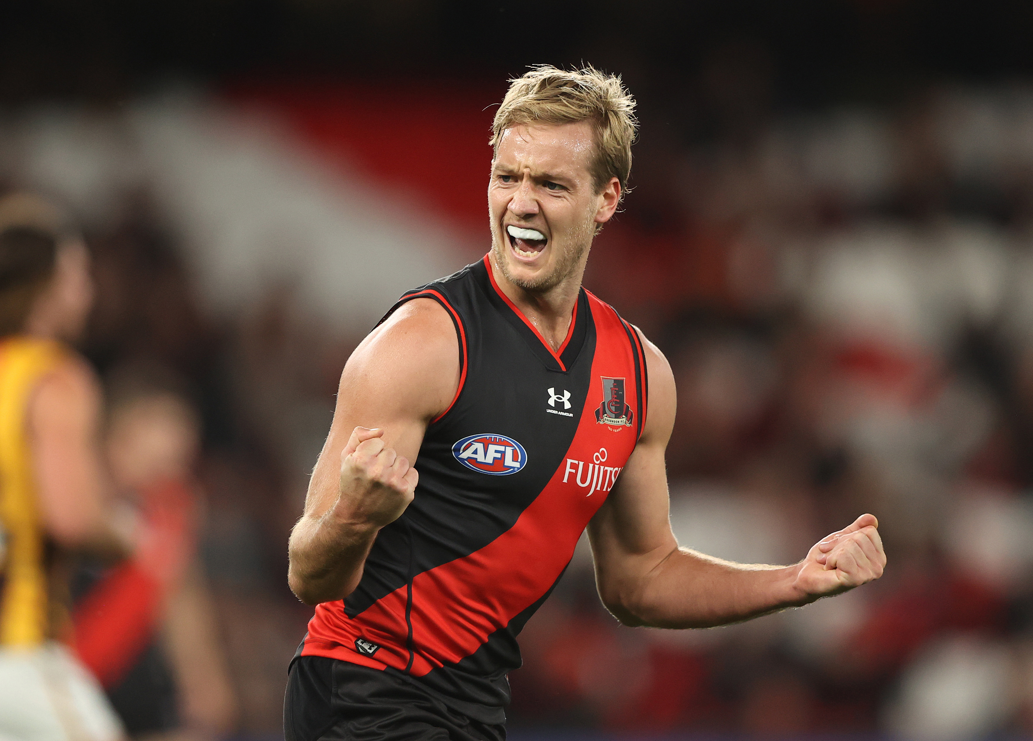 MELBOURNE, AUSTRALIA - MAY 07: Darcy Parish of the Bombers celebrates after scoring a goal during the round eight AFL match between the Essendon Bombers and the Hawthorn Hawks at Marvel Stadium on May 07, 2022 in Melbourne, Australia. (Photo by Robert Cianflone/Getty Images)