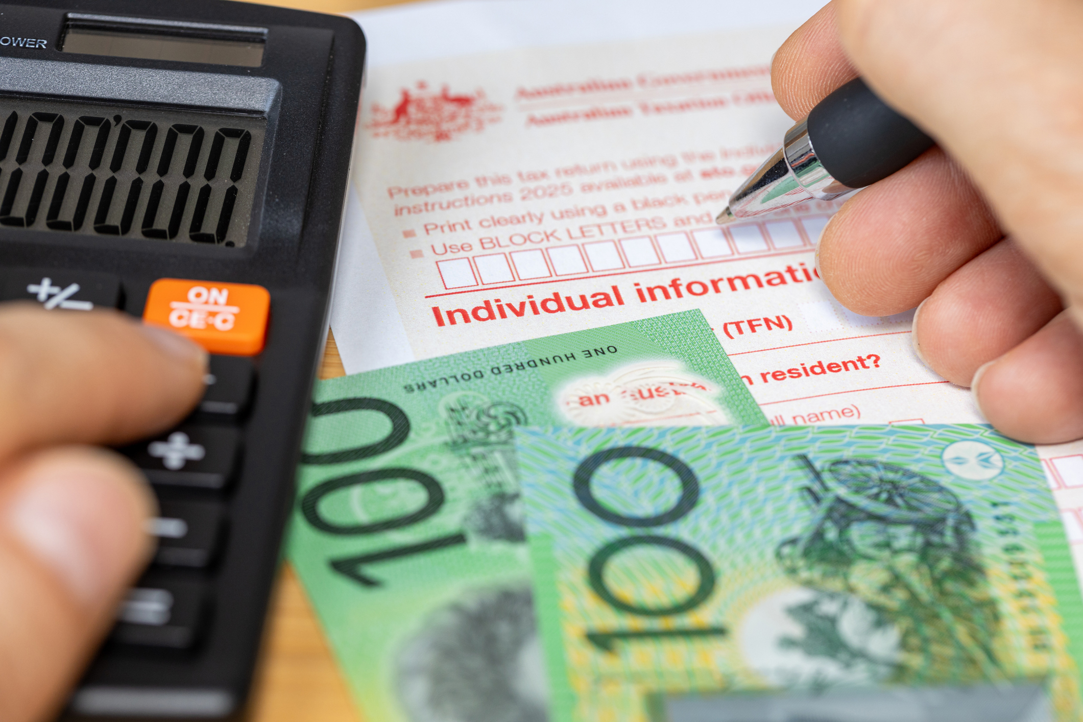 Tax return for individual. Australia tax settlement. Financial and business concept. Calculation and manual filling of the form. close up