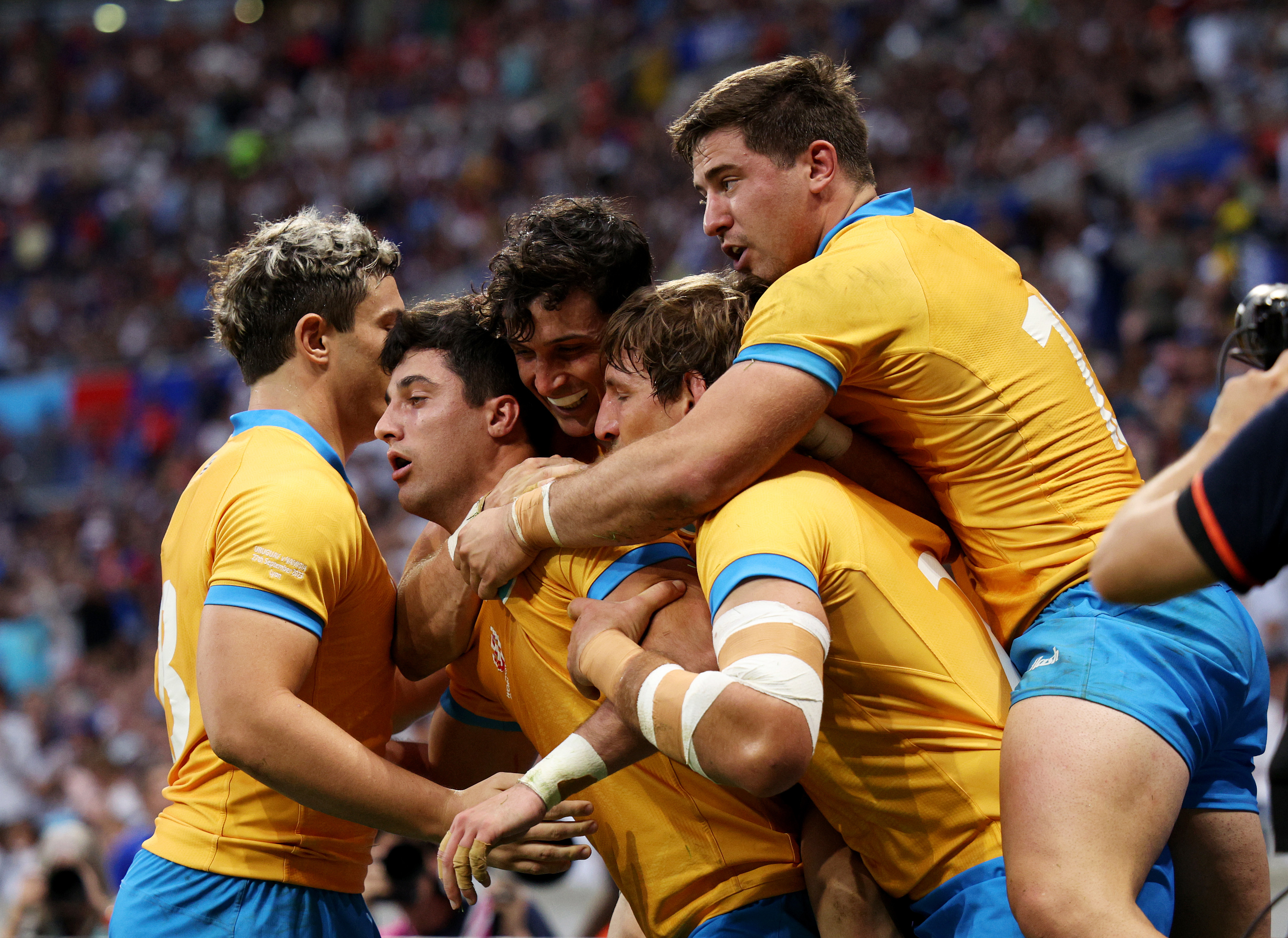 Bautista Basso of Uruguay celebrates with teammates after scoring his team's fifth try during the Rugby World Cup France 2023 match between Uruguay and Namibia at Parc Olympique on September 27, 2023 in Lyon, France. (Photo by Adam Pretty - World Rugby/World Rugby via Getty Images)
