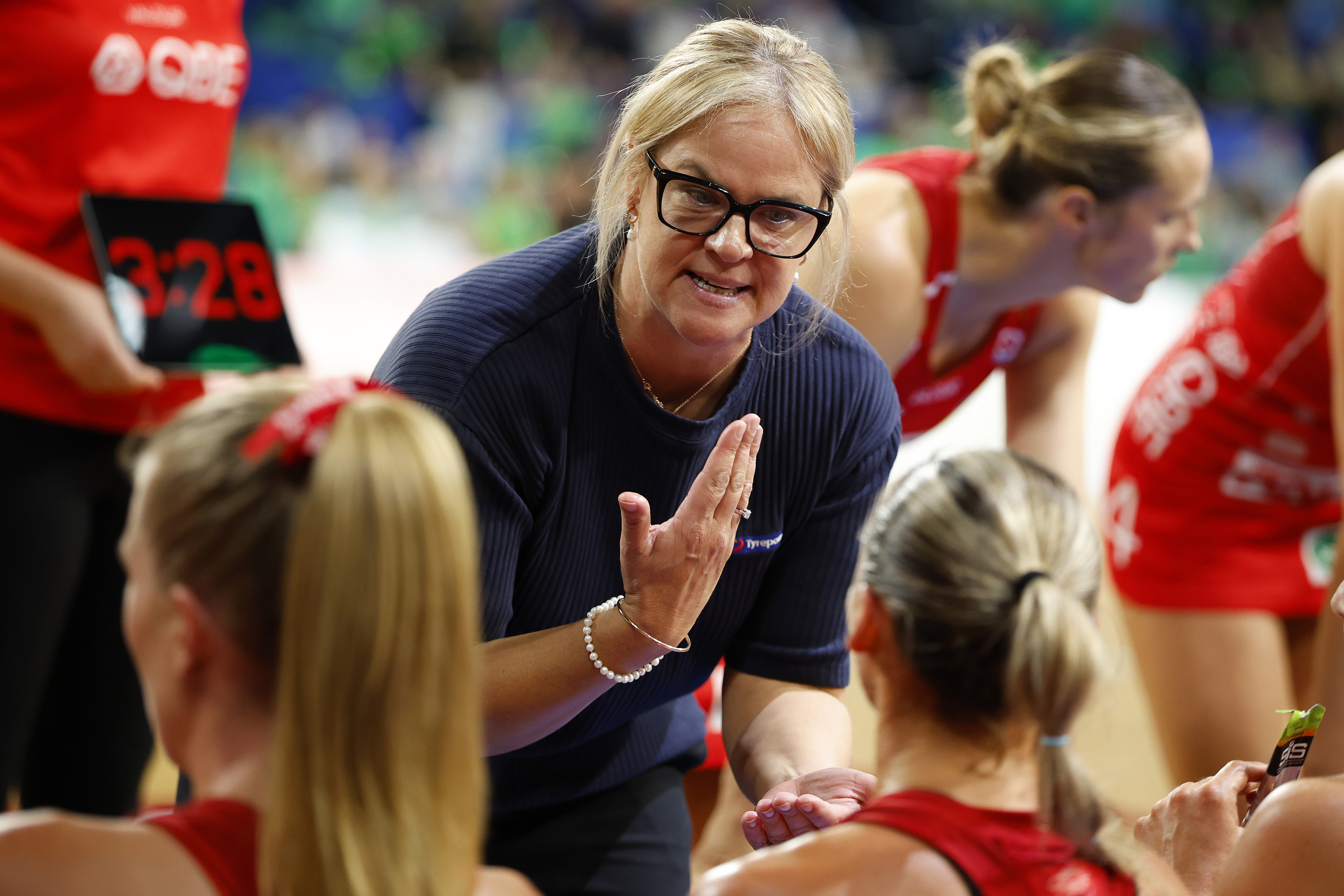 PERTH, AUSTRALIA - MAY 17: Briony Akle Head Coach of the Swifts talks to the players during the 3rd quarter break during the round 10 Super Netball match between West Coast Fever and NSW Swifts at RAC Arena, on May 17, 2026, in Perth, Australia. (Photo by James Worsfold/Getty Images)