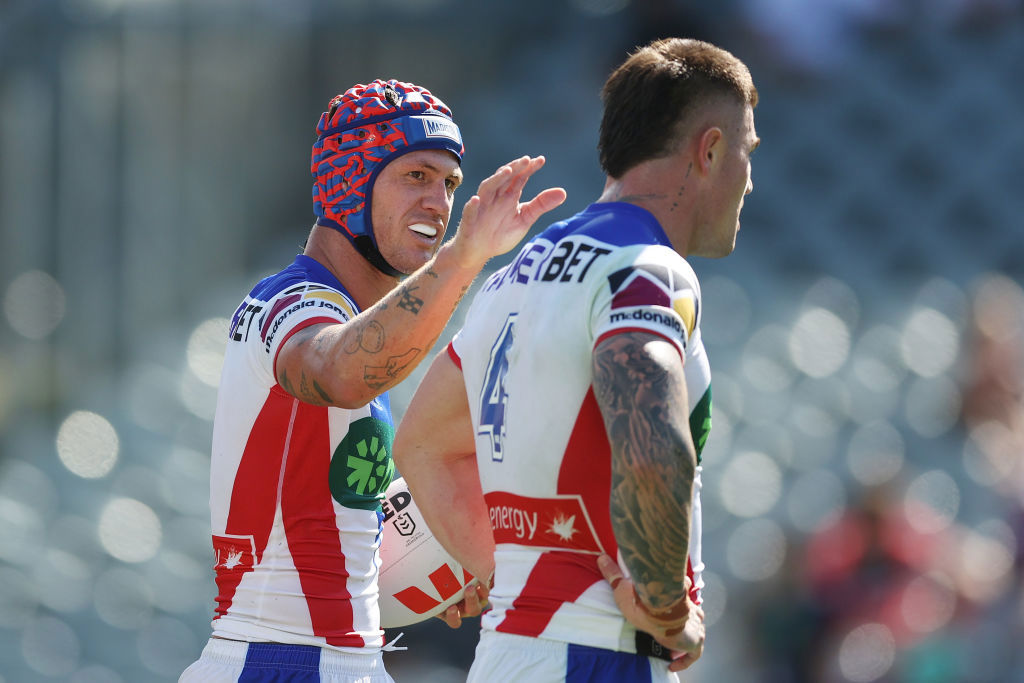 Kalyn Ponga of the Knights celebrates scoring a try with team mate Bradman Best.