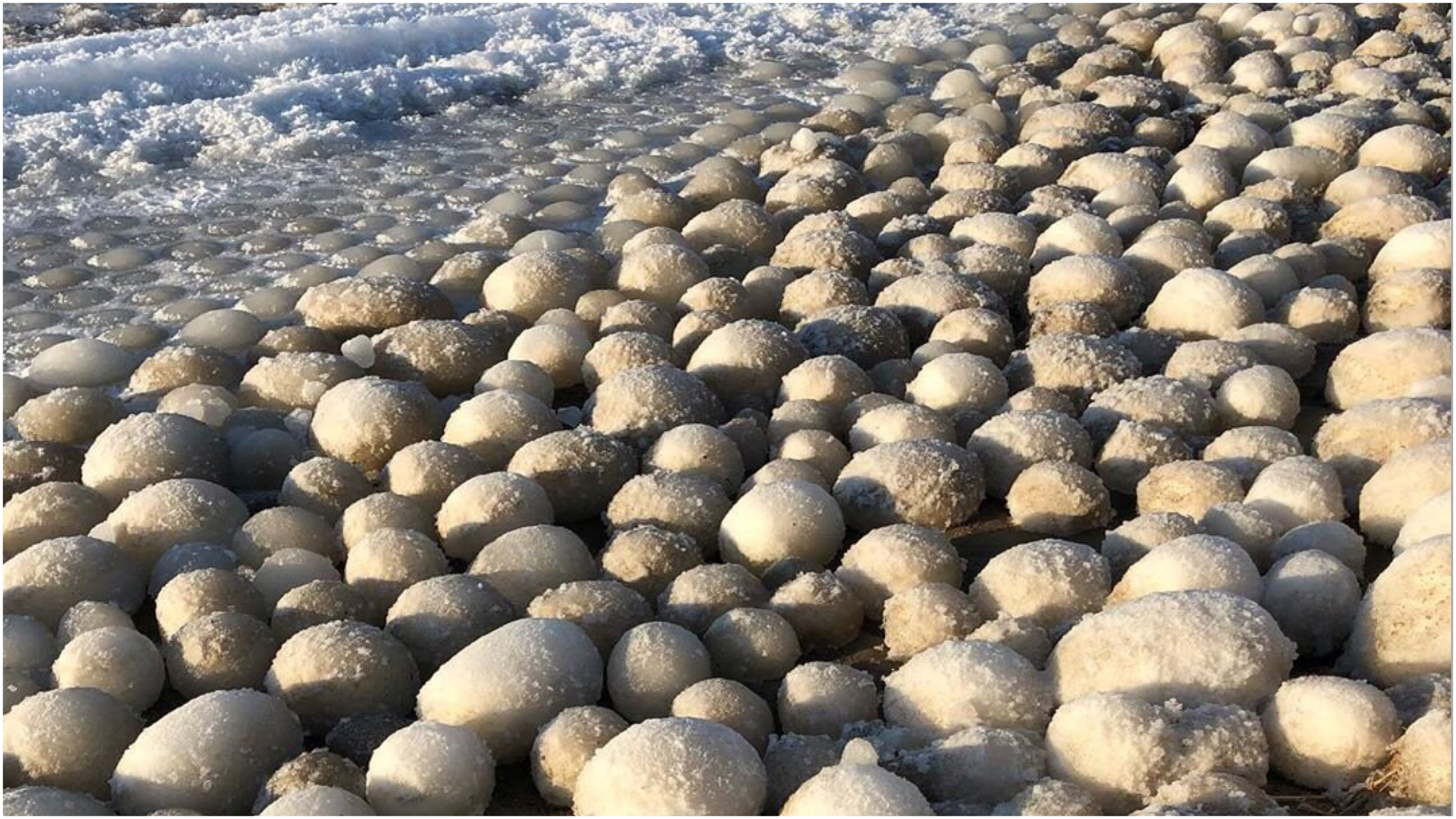 Photographer Captures Picture of Stunning 'Ice Ball' Phenomenon on Finnish  Beach