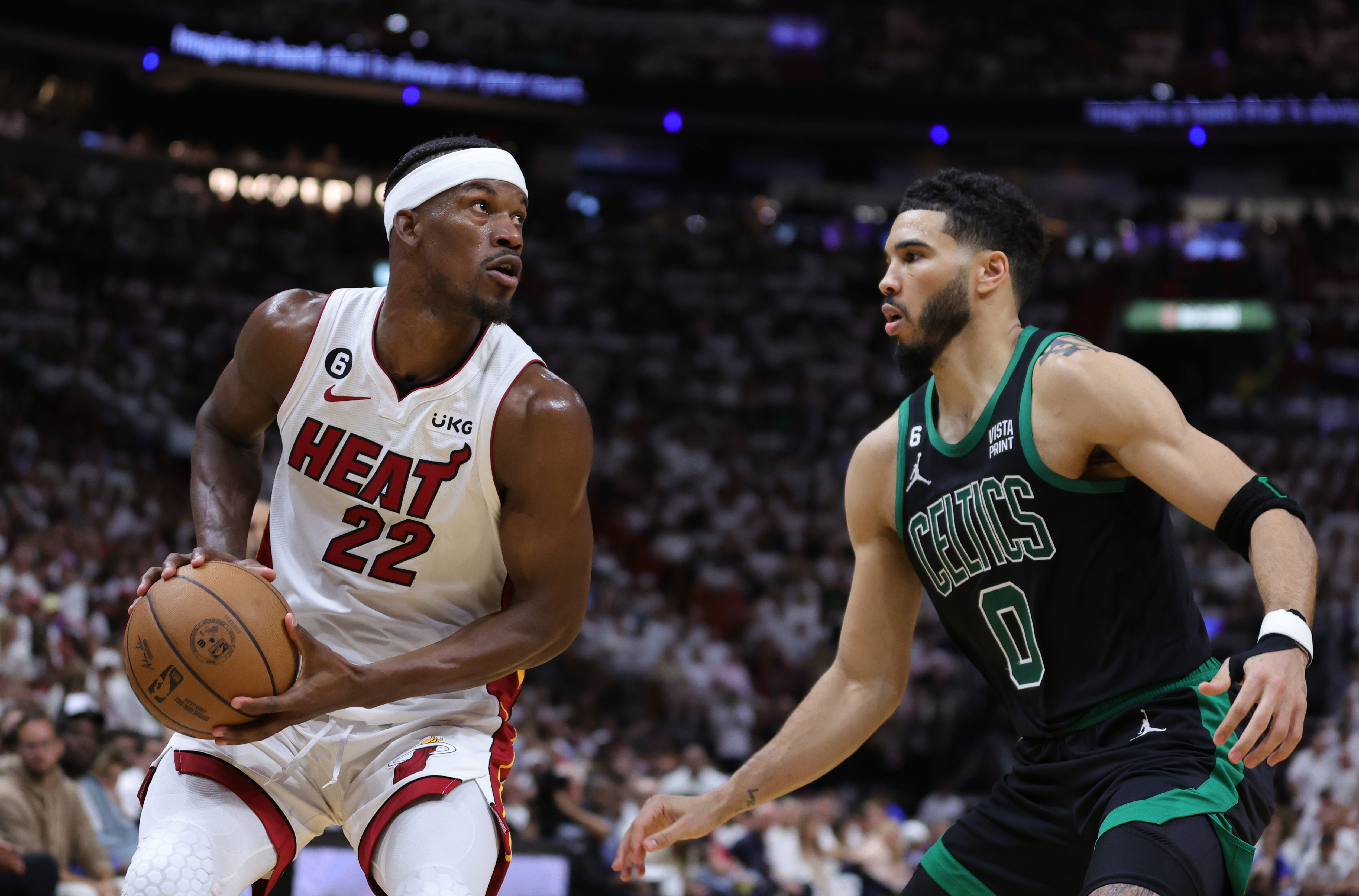 MIAMI, FLORIDA - MAY 21: Jimmy Butler #22 of the Miami Heat drives against Jayson Tatum #0 of the Boston Celtics during the third quarter in game three of the Eastern Conference Finals at Kaseya Center on May 21, 2023 in Miami, Florida. NOTE TO USER: User expressly acknowledges and agrees that, by downloading and or using this photograph, User is consenting to the terms and conditions of the Getty Images License Agreement. (Photo by Megan Briggs/Getty Images)