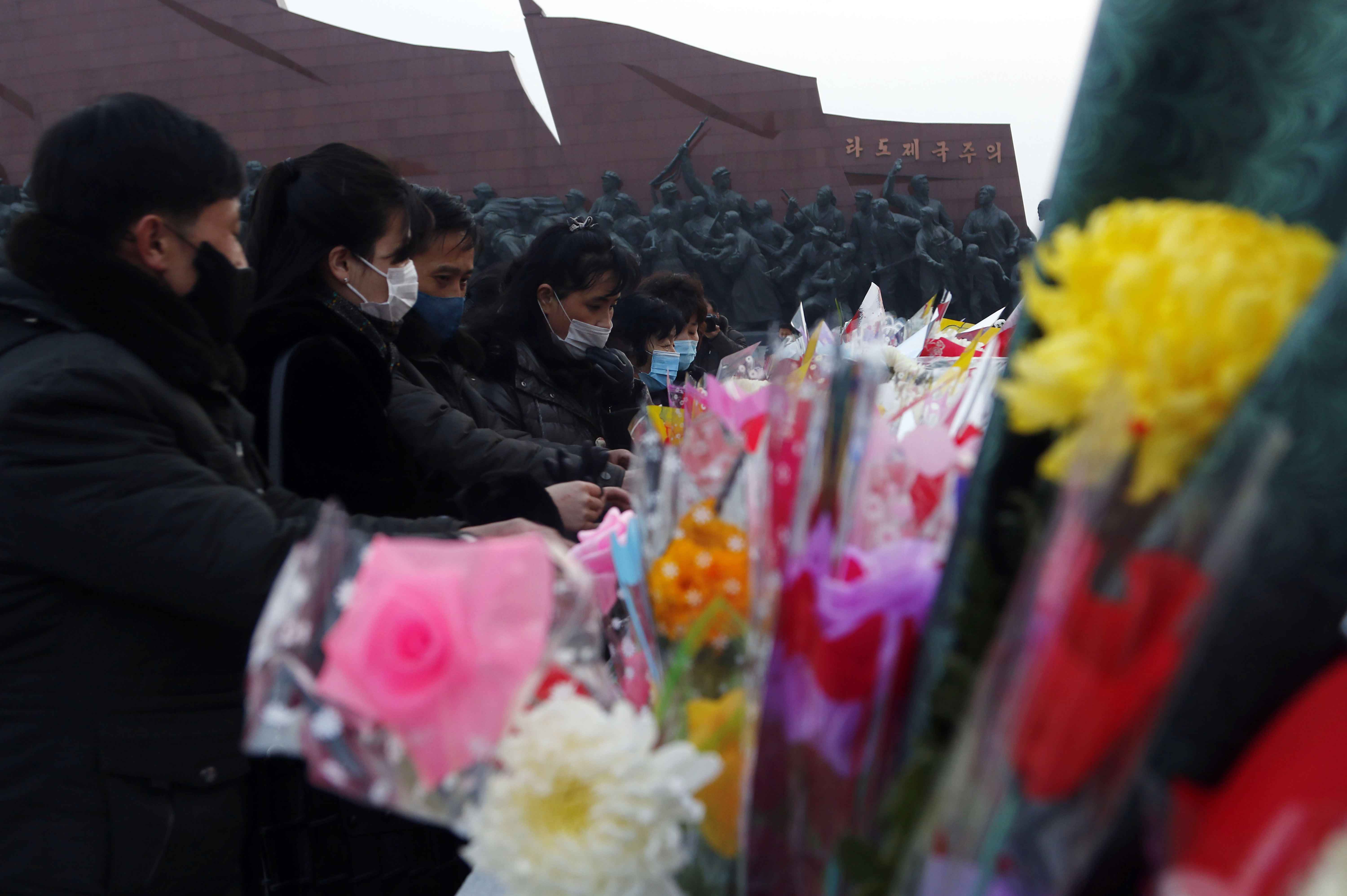 Citizens visit the statues of President Kim Il Sung and Chairman Kim Jong Il on Mansu Hill