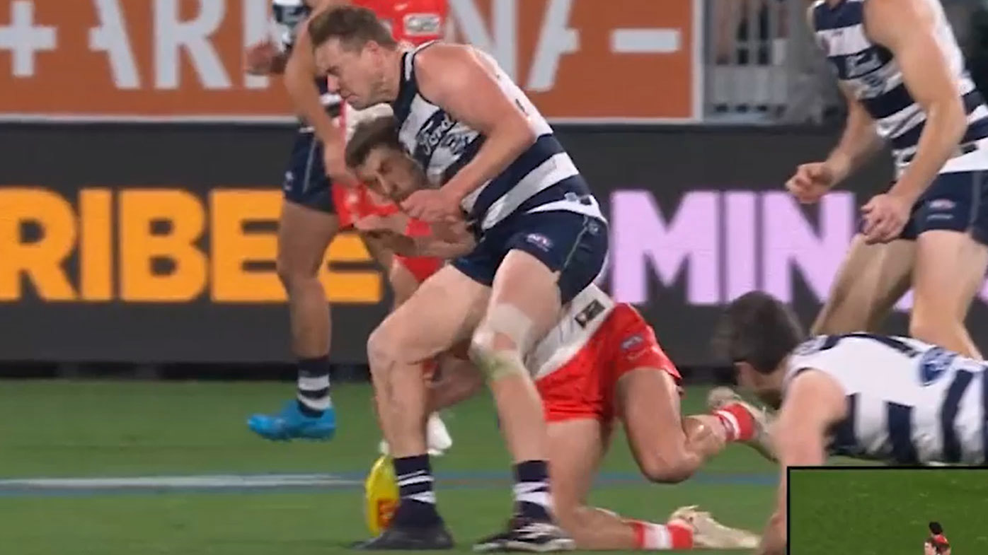 Geelong star Mitch Duncan faces a nervous wait after this bump on Sydney's Robbie Fox